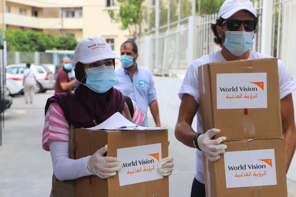 Staff carrying boxes