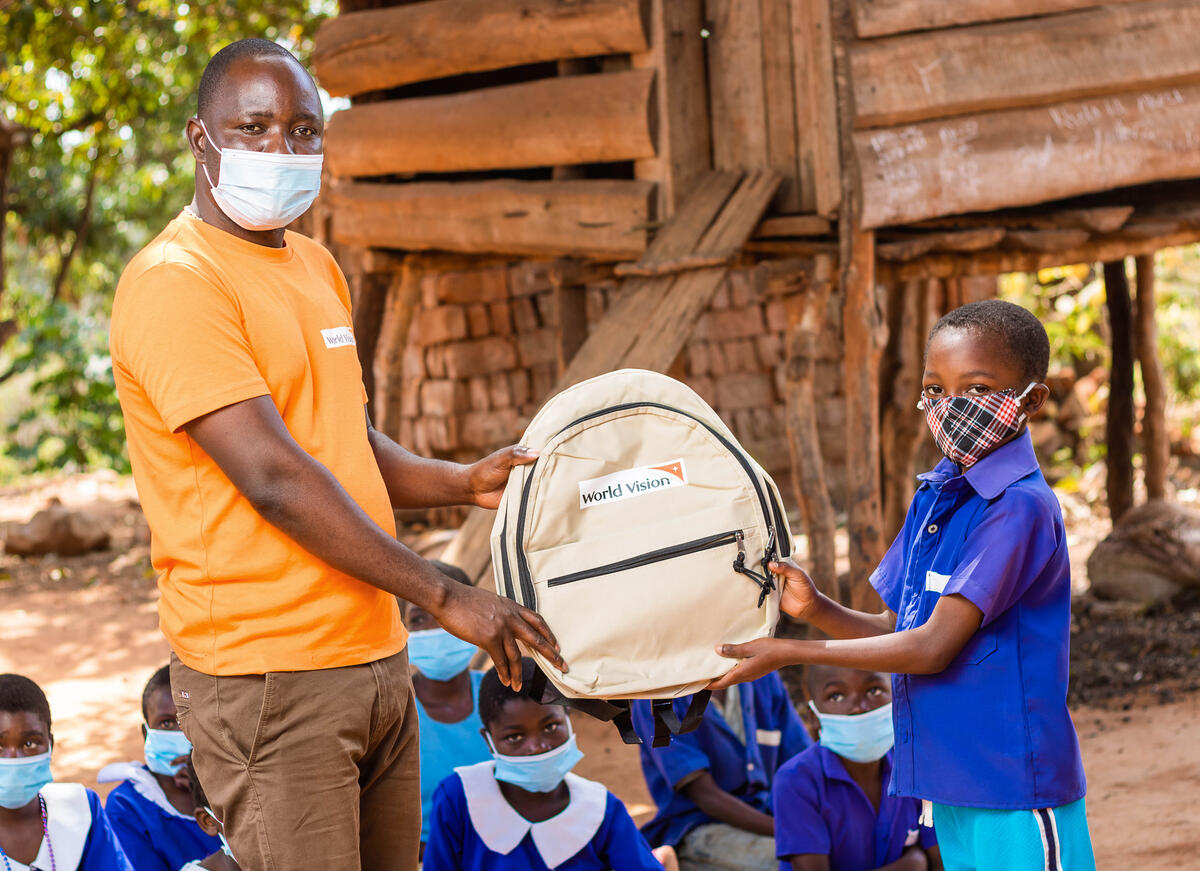 Phillip receives a backpack from World Vision Malawi
