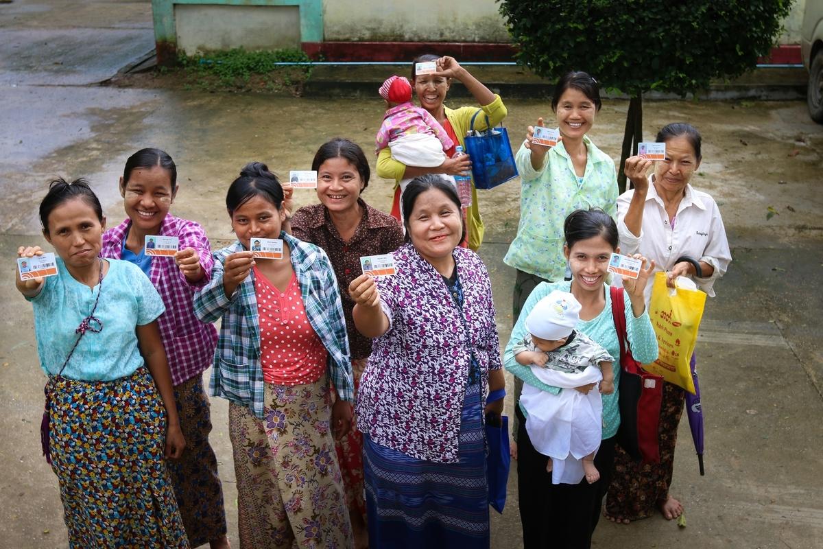 Women in Myanmar with their LMMS assistance cards. Khaing Min Htoo/World Vision