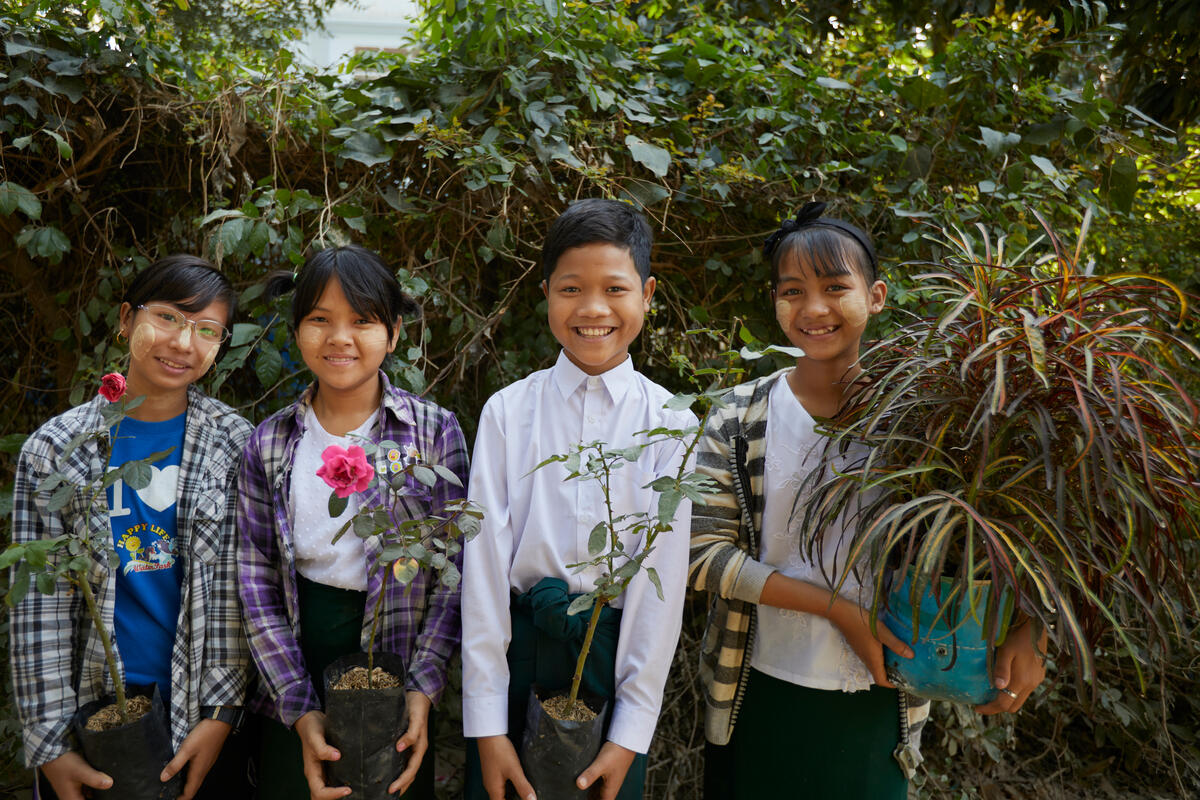 Youth climate change advocates plant trees and pick up garbage in Myanmar