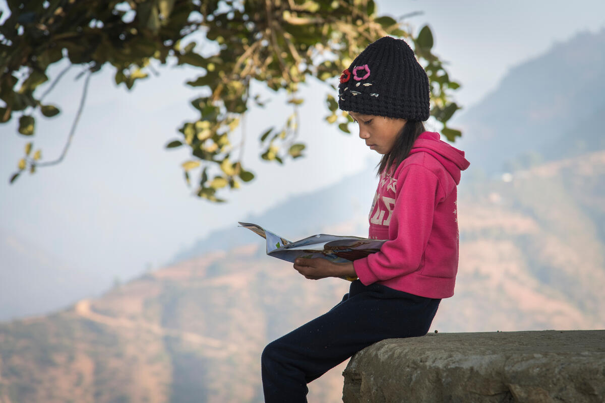 sponsored child reading a letter