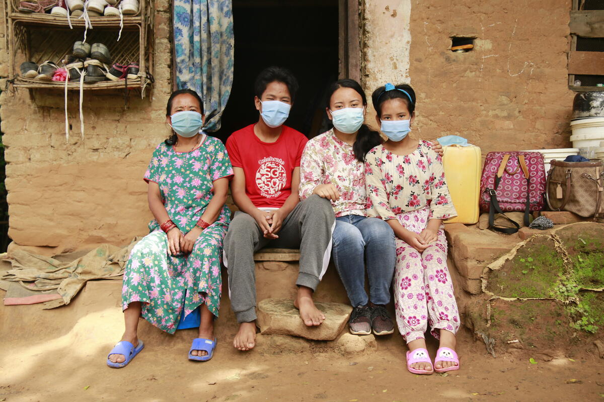 Family of sponsored child in front of their home in Nepal