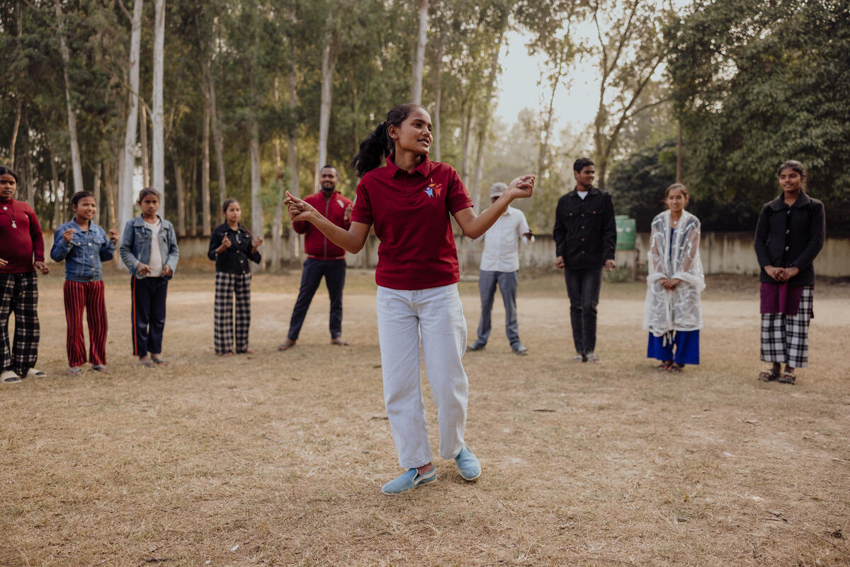 Neha standing between her friends 