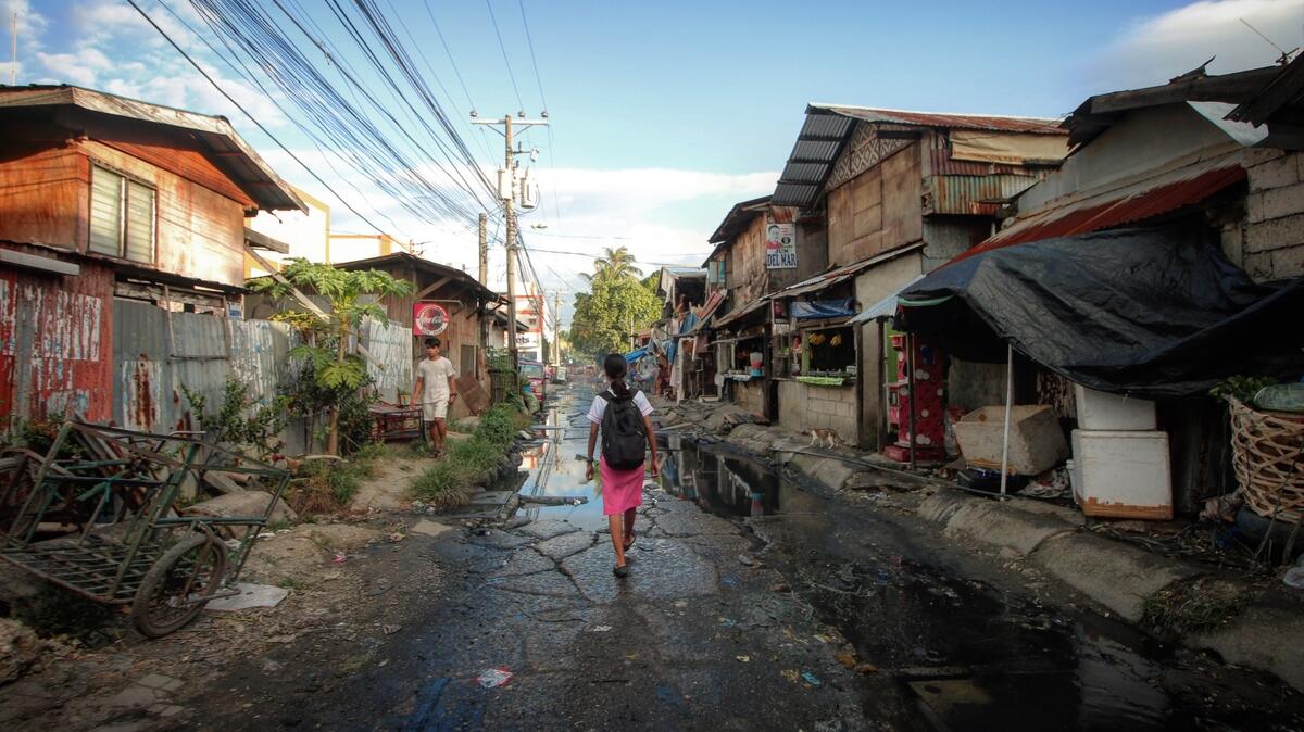 Angel walks through the streets where she lives