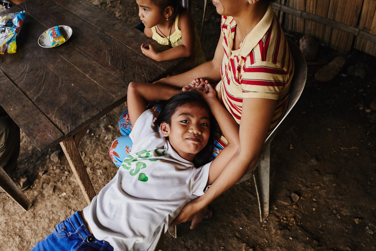 a child laying on his mother