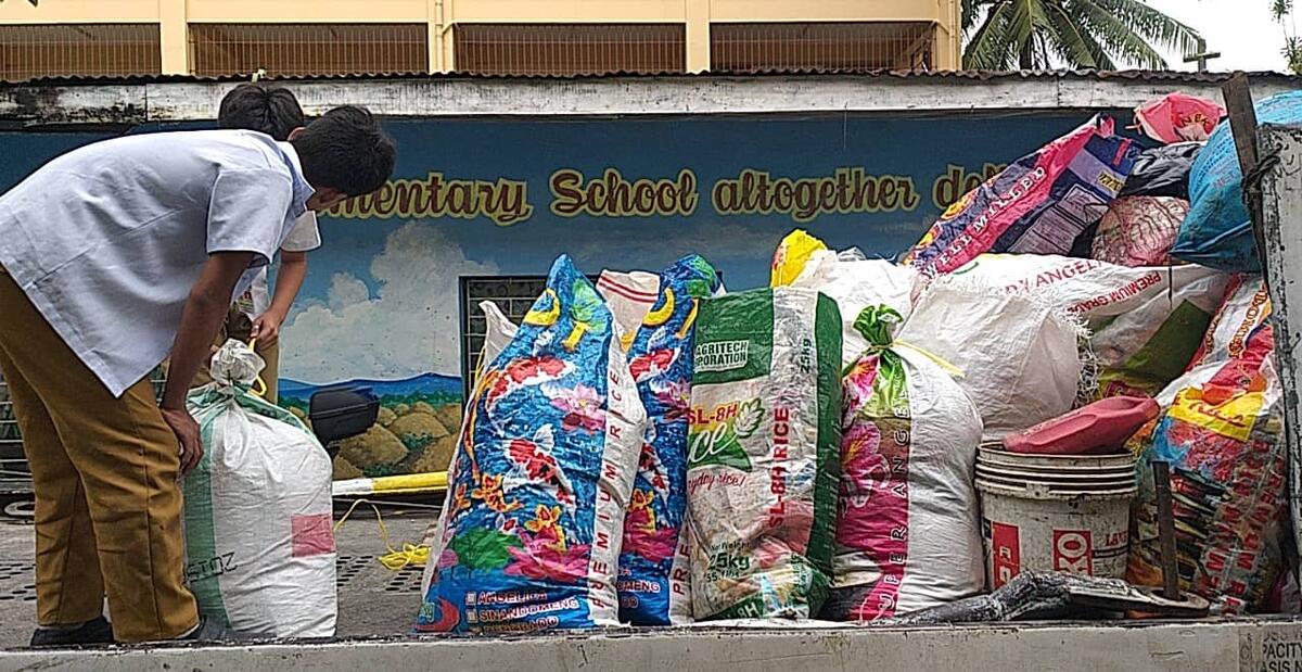 Students receive rewards for recycling the plastic bottles and sachets.