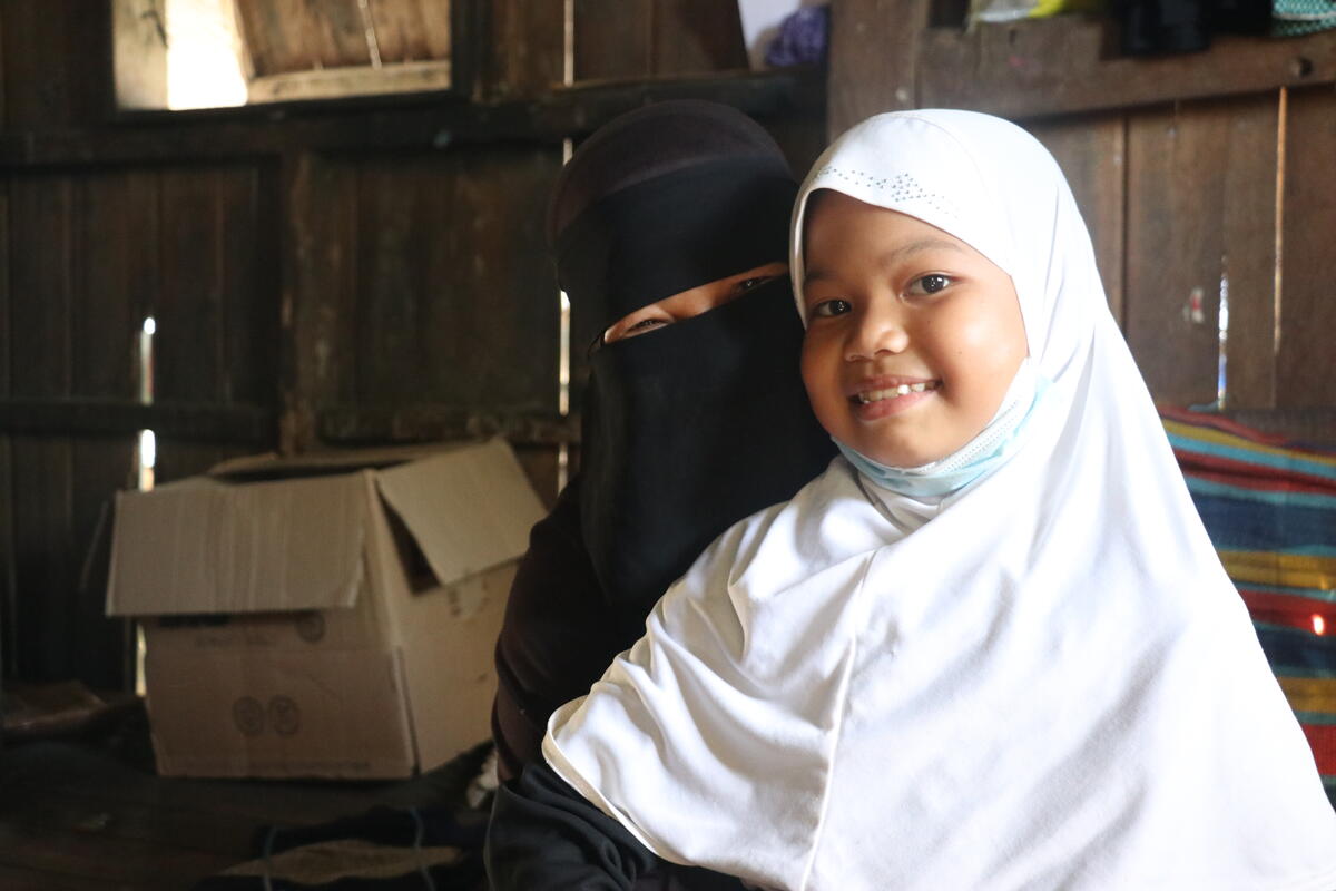 Salma and her mother in their home