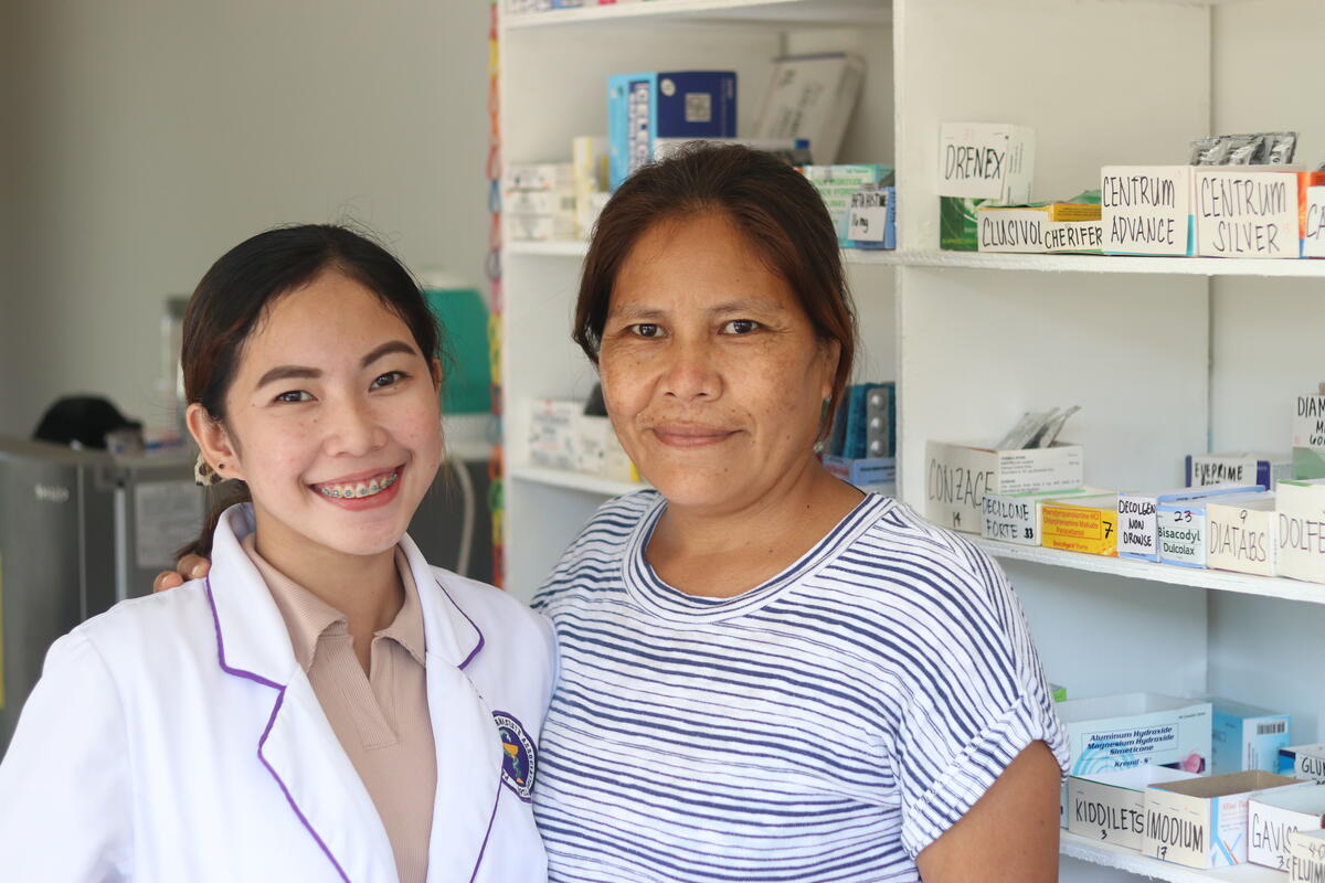Lesly and her mother in their family-run pharmacy.