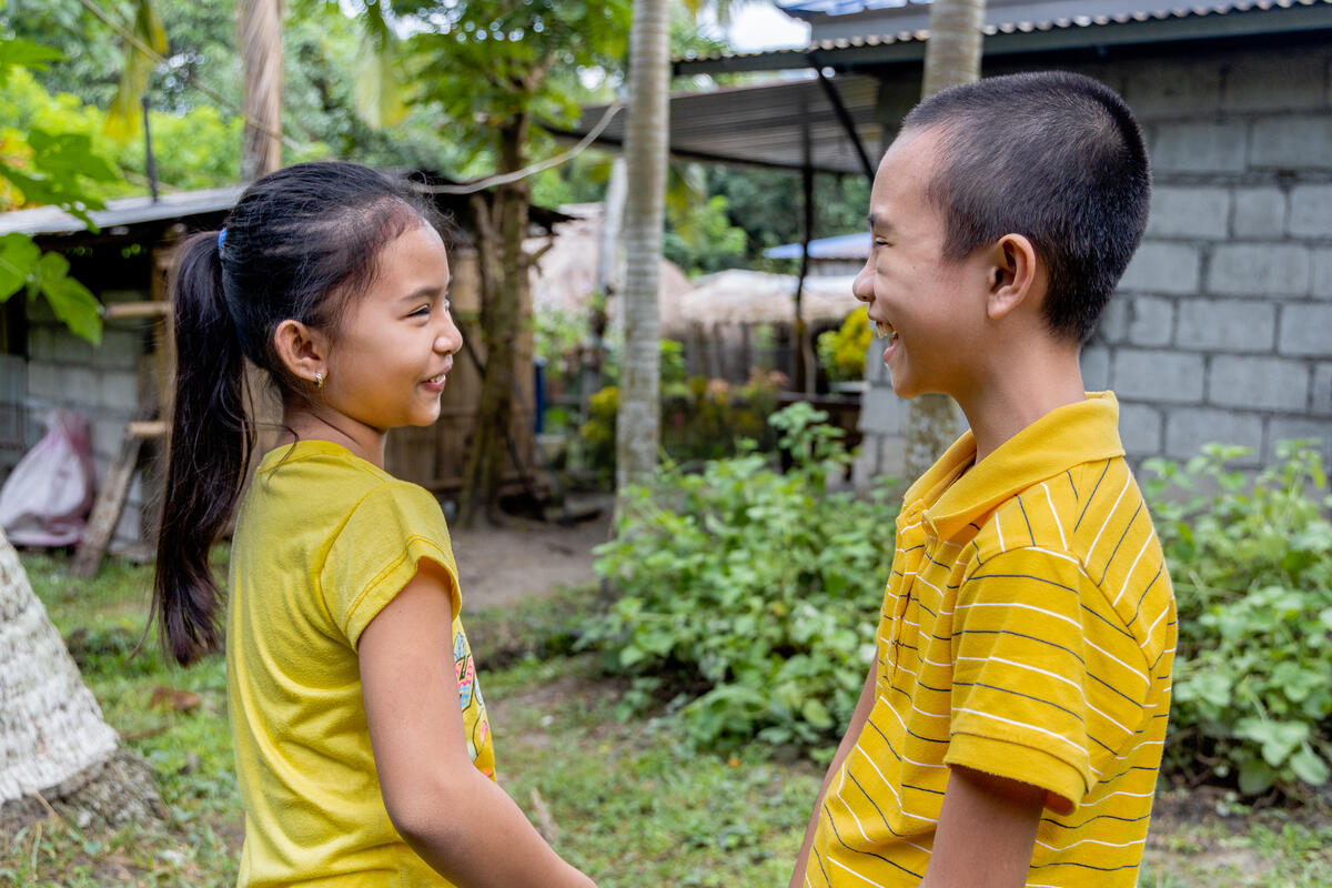 Justin with his sister now able to play again thanks to a surgery in the Philippines