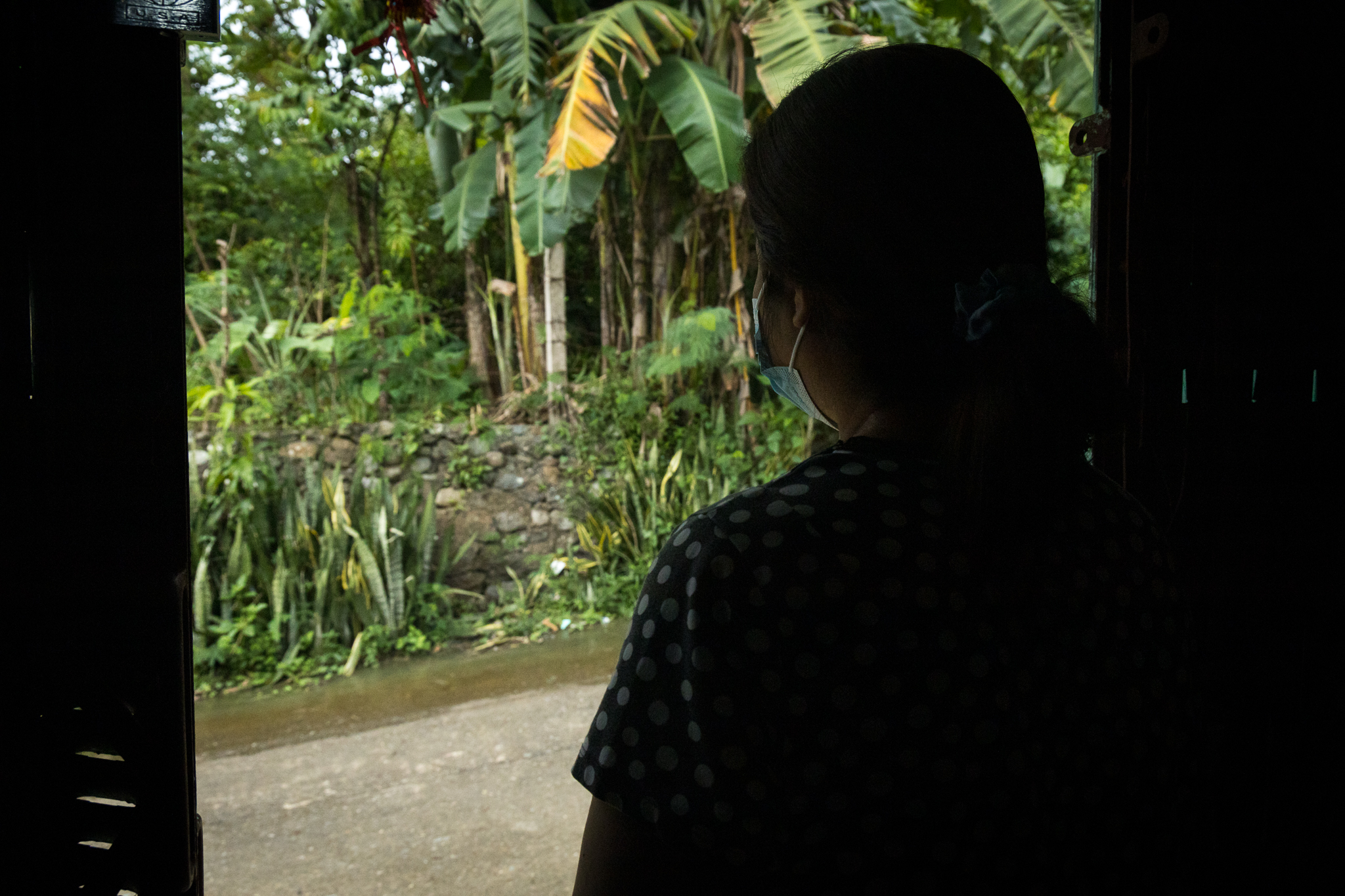 An abused woman during the Typhoon Goni