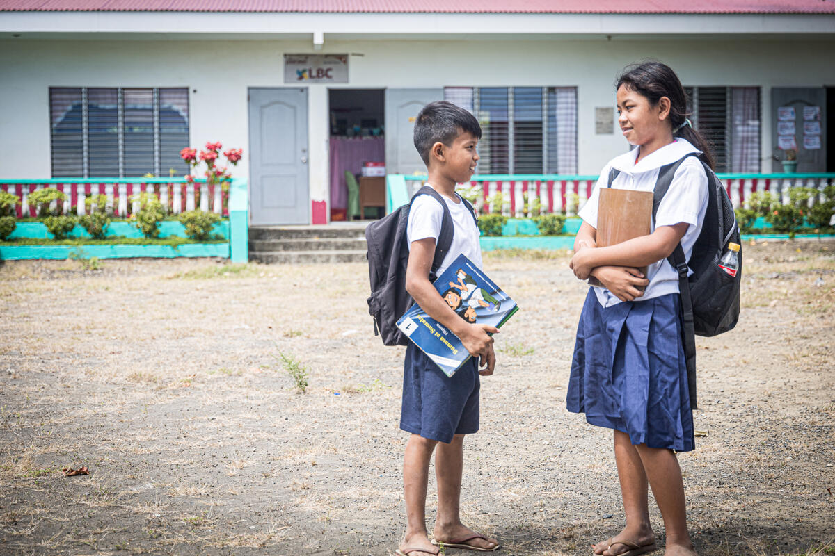 Children standing outside their school