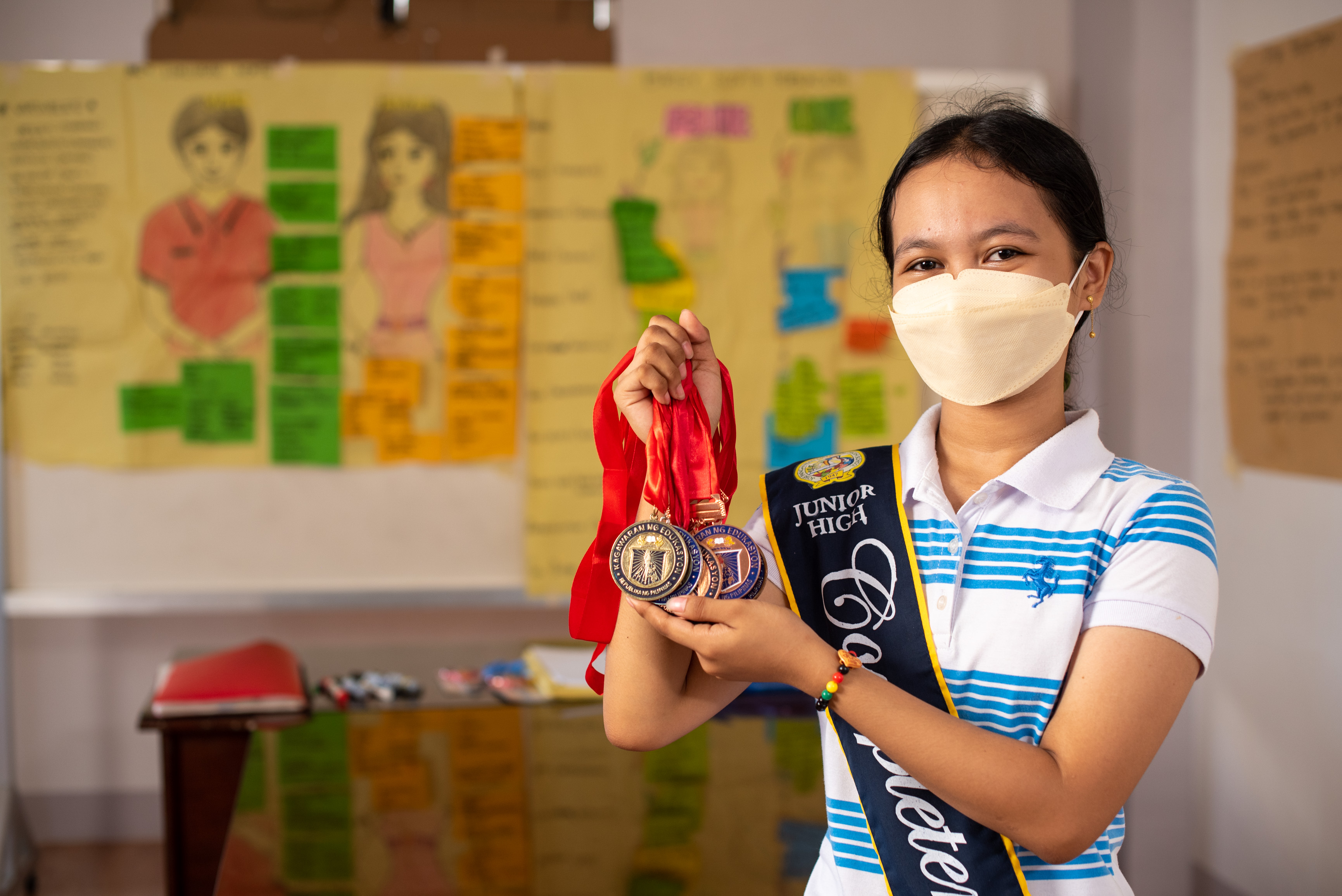 Alyza, now both an ambitious student and community child leader