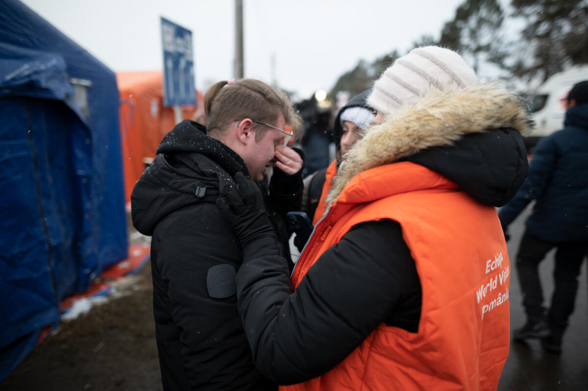 World Vision staff comfort Ivan a teenager who fled Ukraine alone.