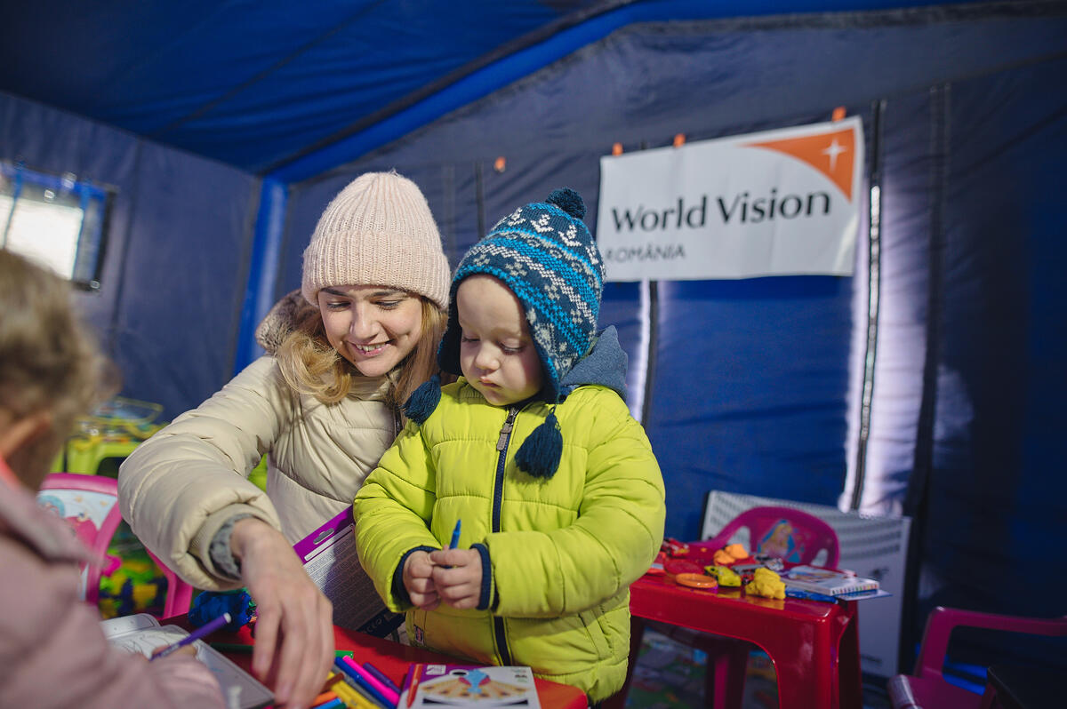 A child plays in a safe space provided by World Vision on the border of Ukraine