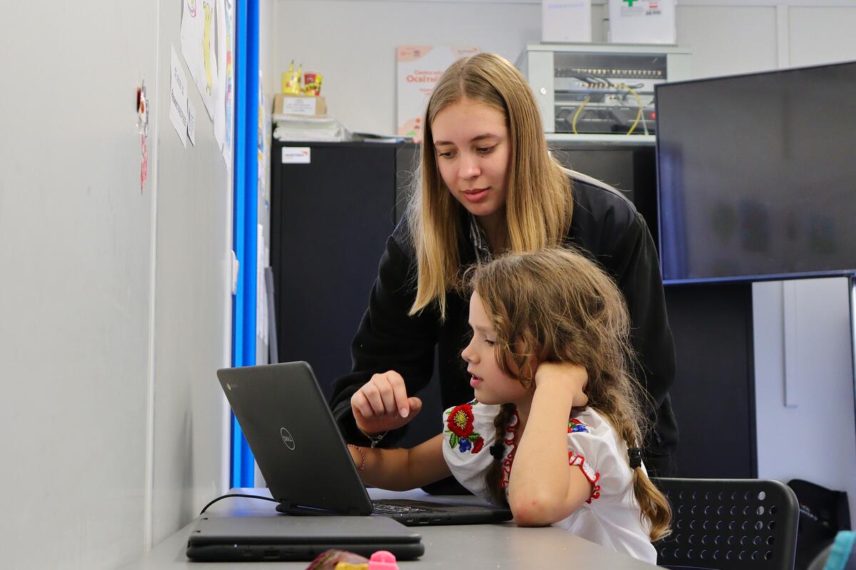 Karina Lazarovych, volunteers at World Vision's Portable Connectivity Center in Suceava, Romania, to help Ukrainian refugees stay in touch with their family and friends at home.