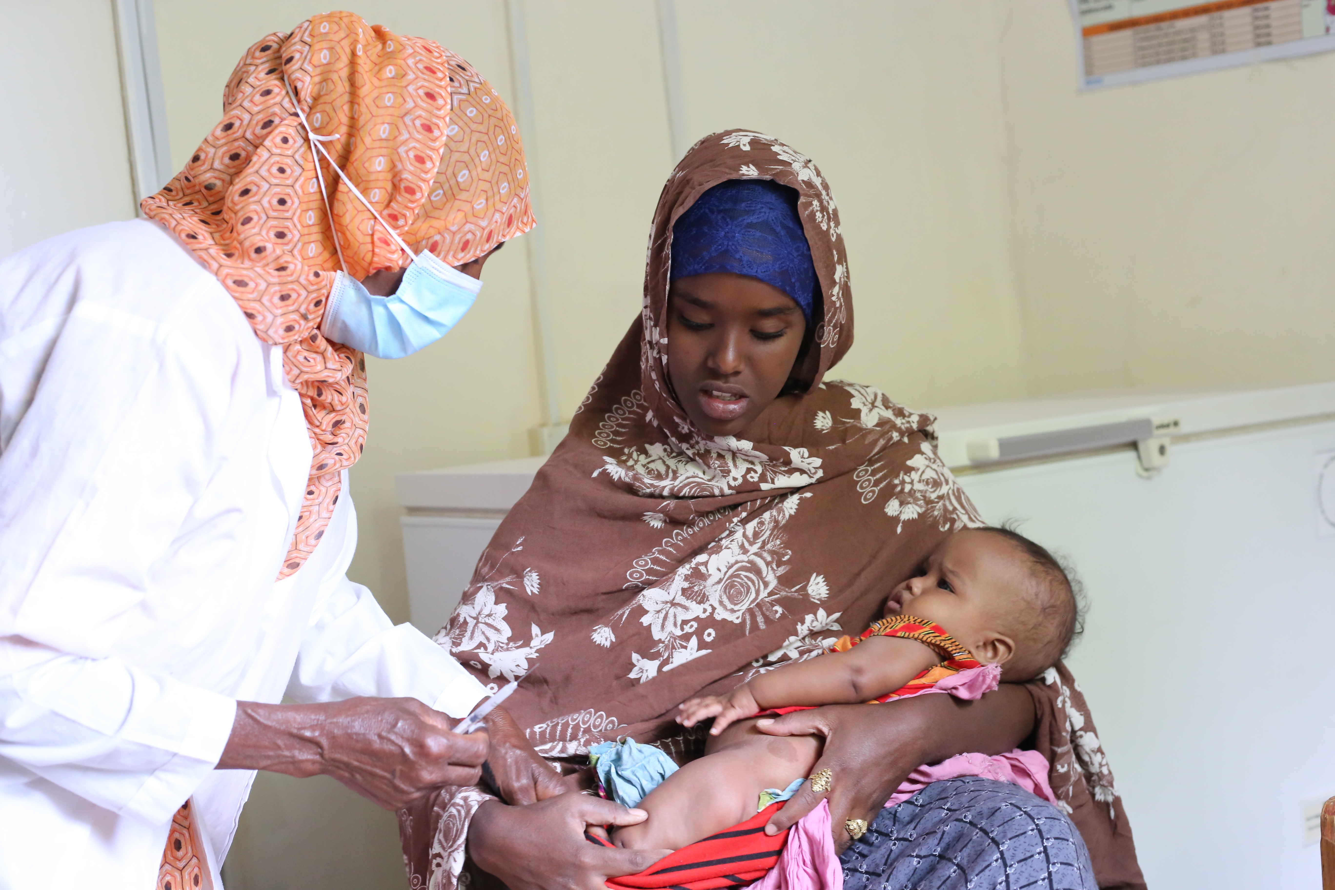 Faadumo's two and half-months old receiving the vaccine from Gabiley MCH in August 2021