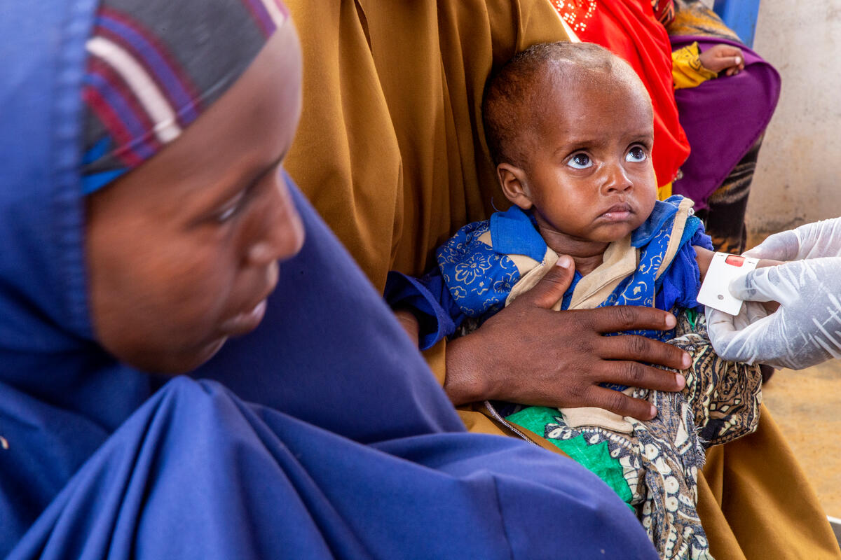 child measured for  malnutrition