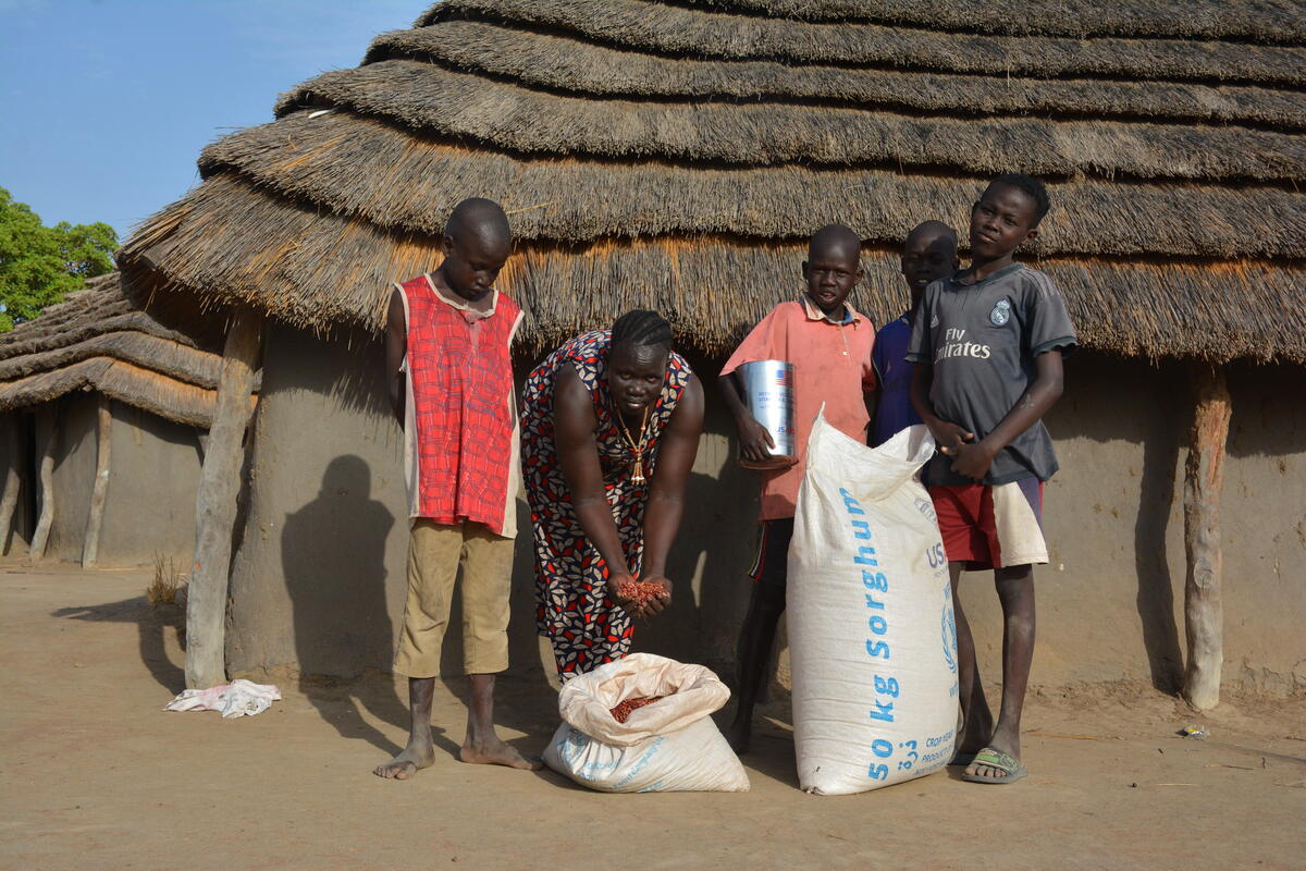 family with food aid in south sudan