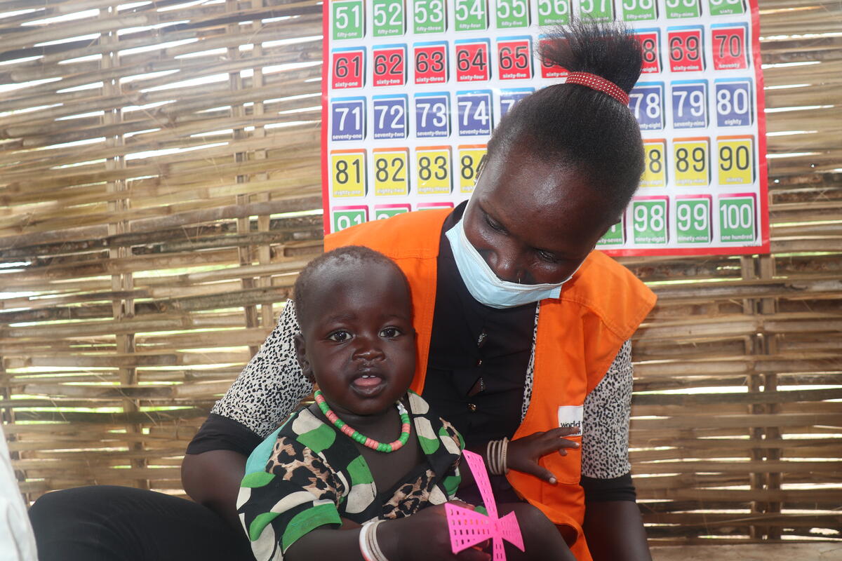 One-year-old Aluel with a World Vision South Sudan staff member.
