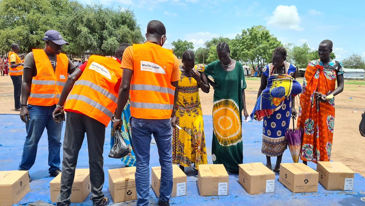 World Vision South Sudan staff deliver the food aid.