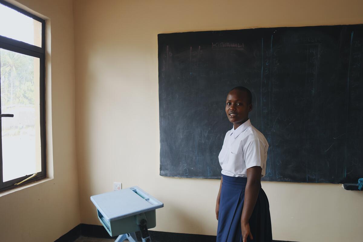 Esther walks 8km to get to school, risking sexual violence on the way. 