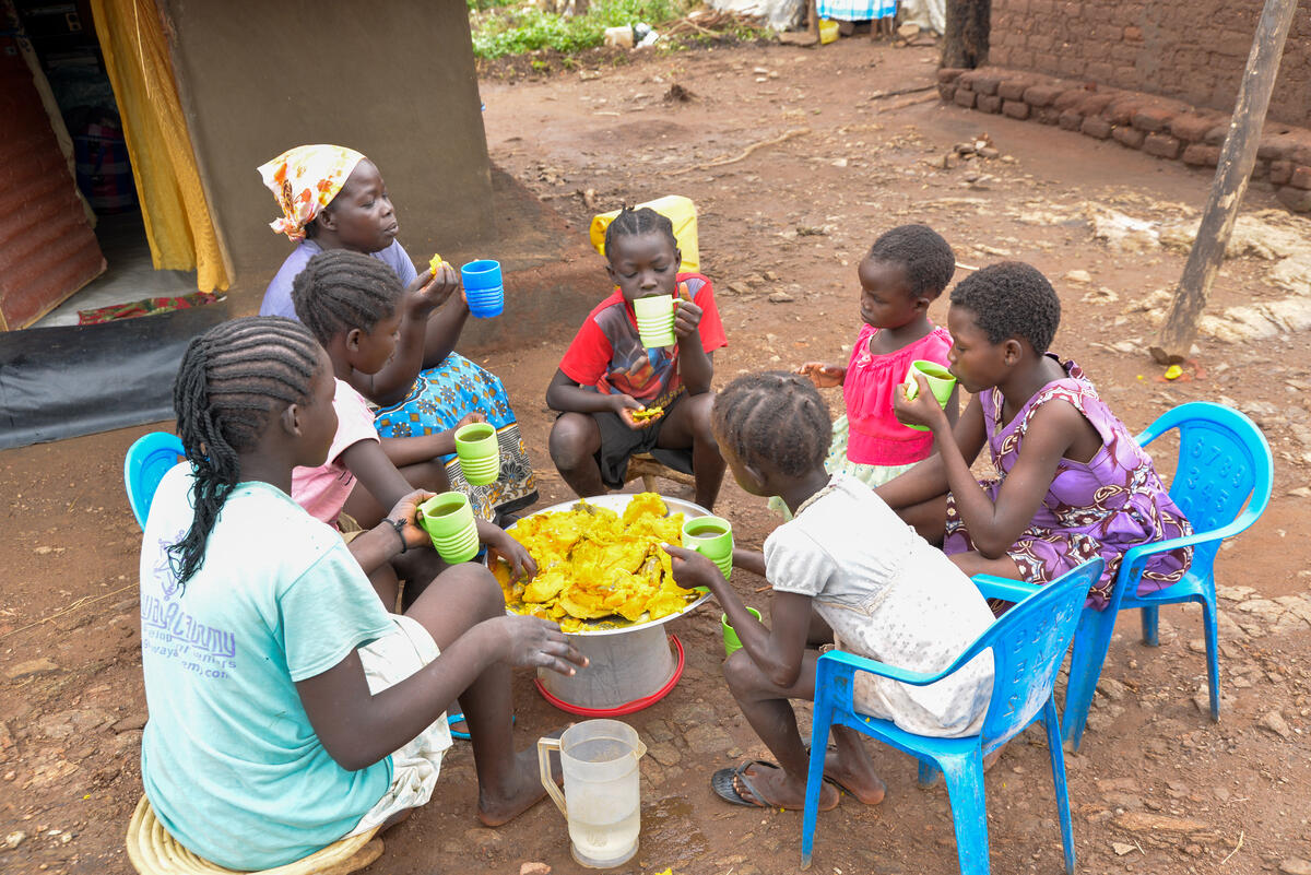 Children join together and eat pumpkin