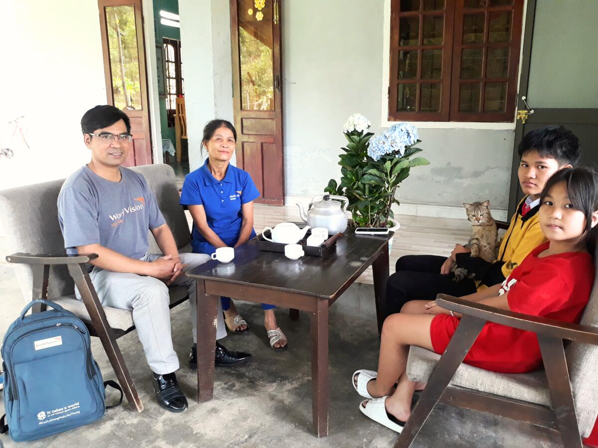Photo 5: World Vision Việt Nam’s  home visiting officer made regular trips to Mrs. Hường’s house to accompany her family during the implementation of the livelihood models and response plan