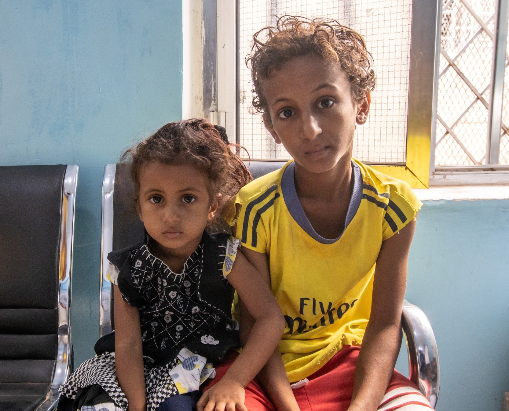 Children waiting for their turn to get examined for malnutrition in Al Millah district clinic in Yemen