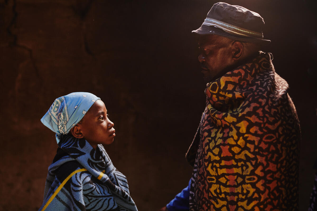 A father looking at his child- child marriage context.