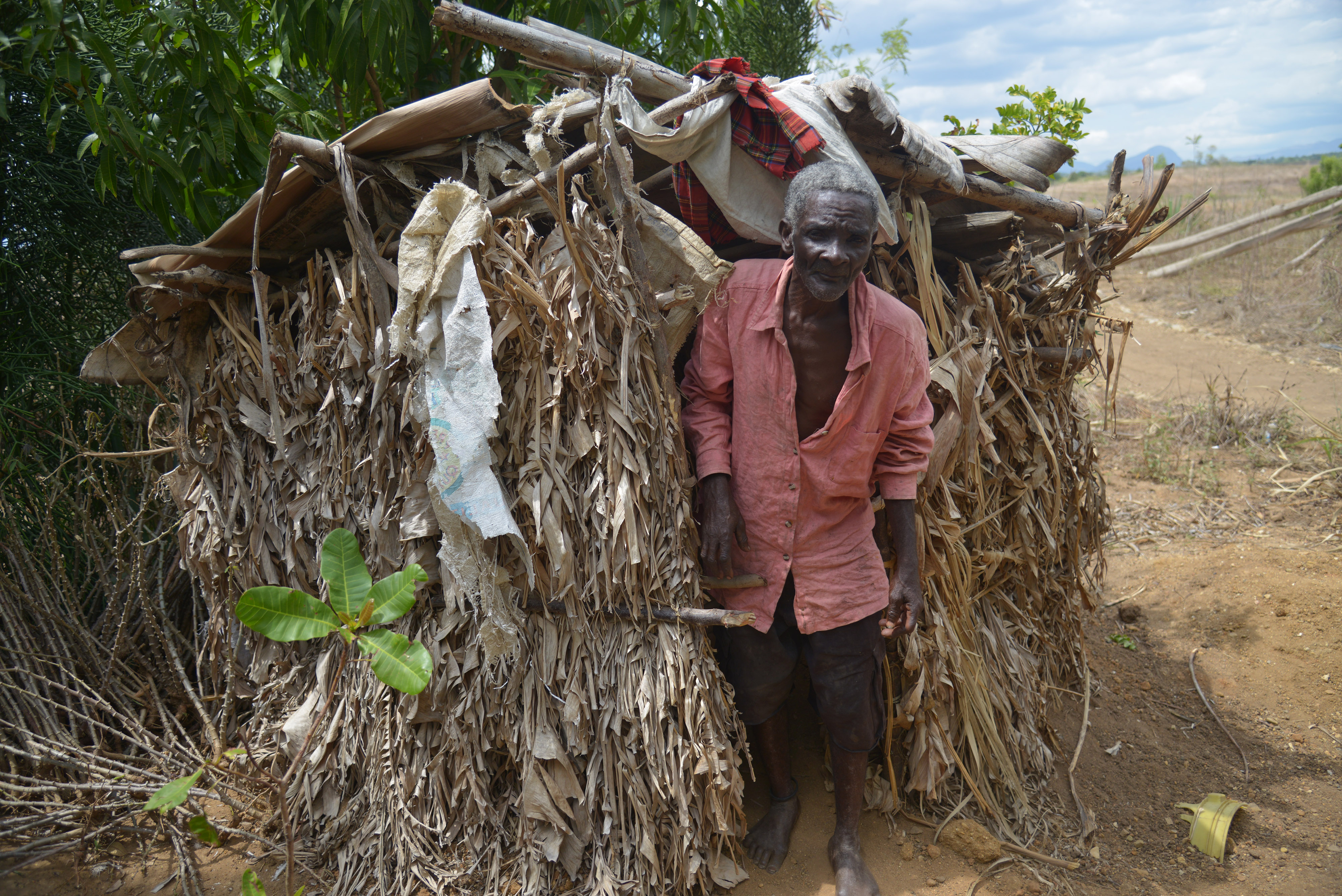 Polès Monpremier, a 62 year-old grandfather, coming out of his proudly built latrine