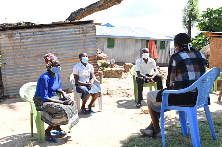 Stella (left) – a community health volunteer supported by World Vision - encouraging families to keep hope alive amid the COVID-19 pandemic at her village in in Bartabwa at Baringo County, Kenya.