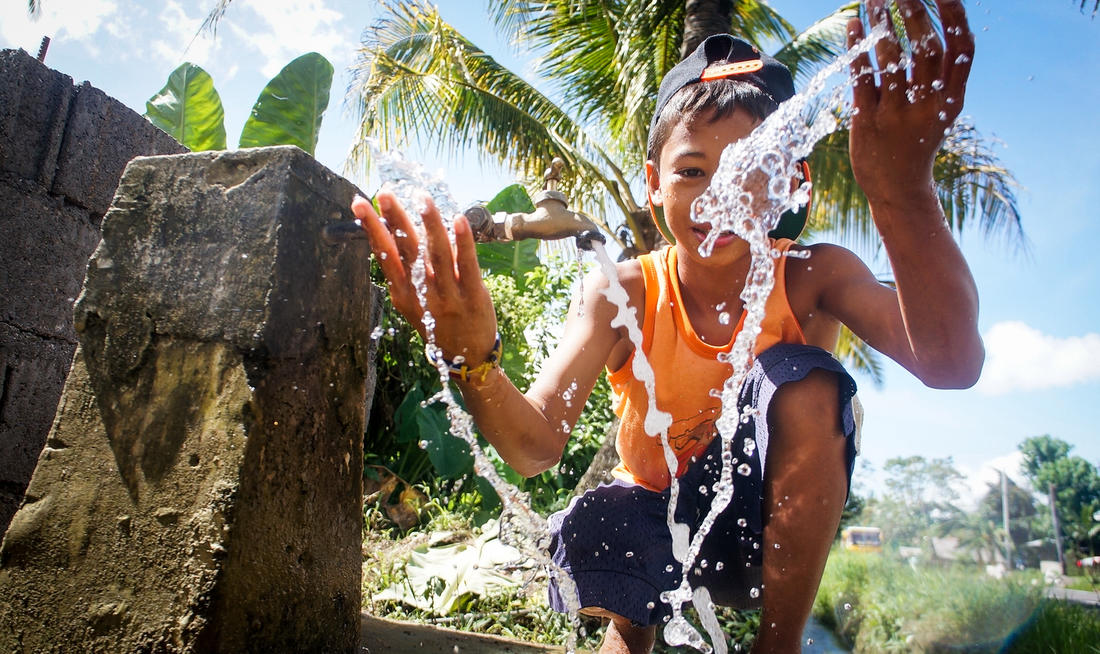 A child enjoys fresh, clean water