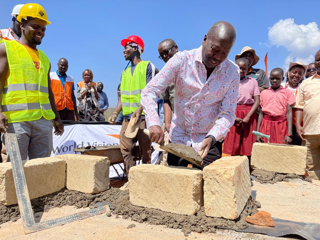 Baringo County Governor Benson Cheboi lays the foundation for the school in Aroket