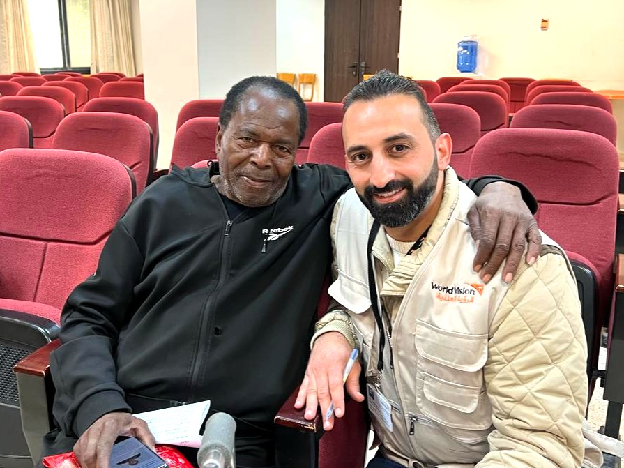 Fayez, 81 years old, during a distribution of essential items