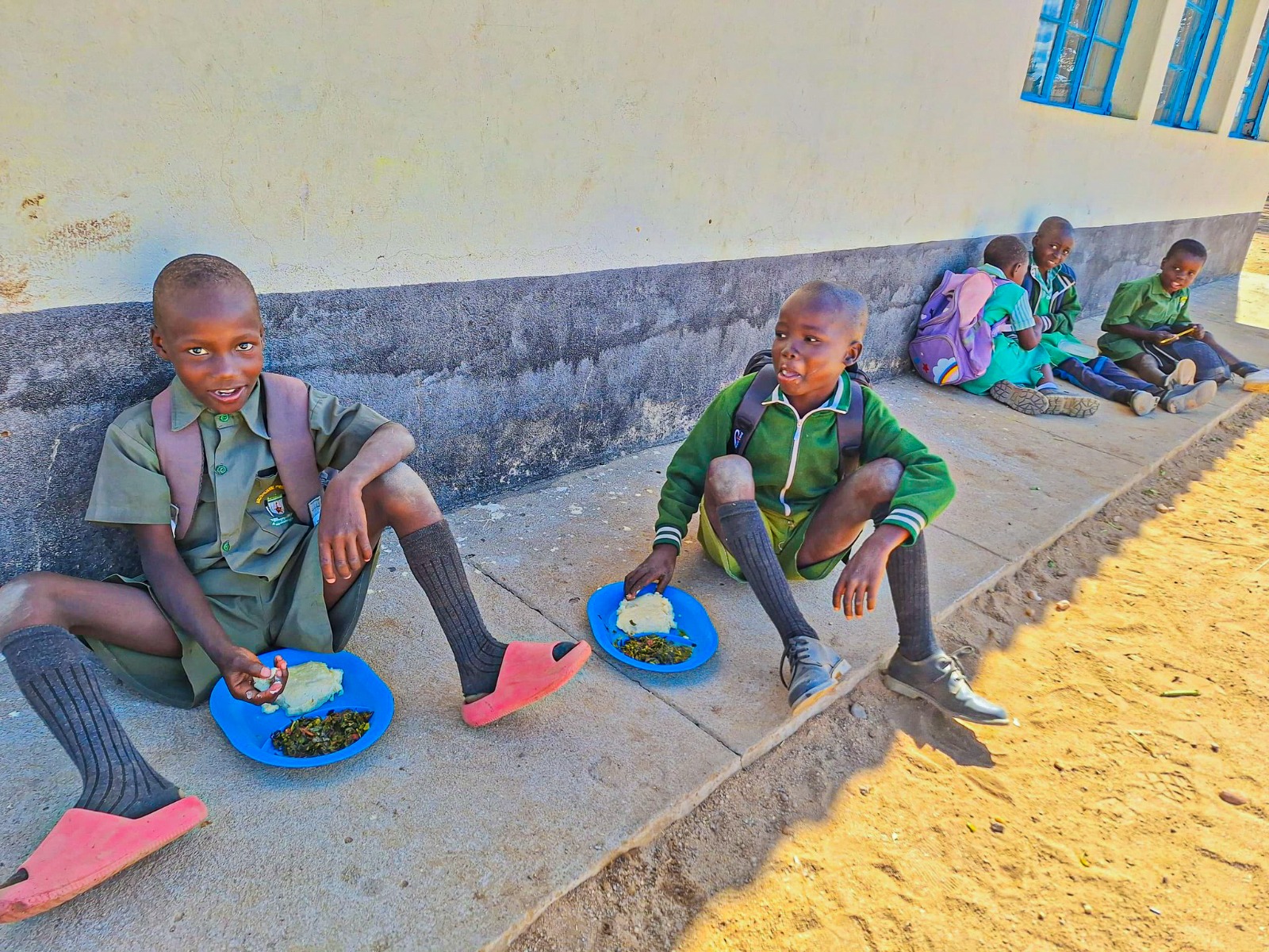 Students at Mushumbi enjoy a nutritious meal provided by the school