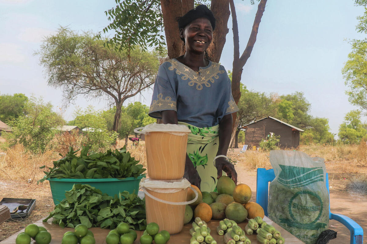 Woman smiling selling fruit