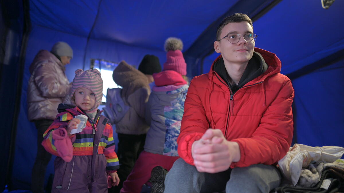 Child refugee from Ukraine in Romania with his family