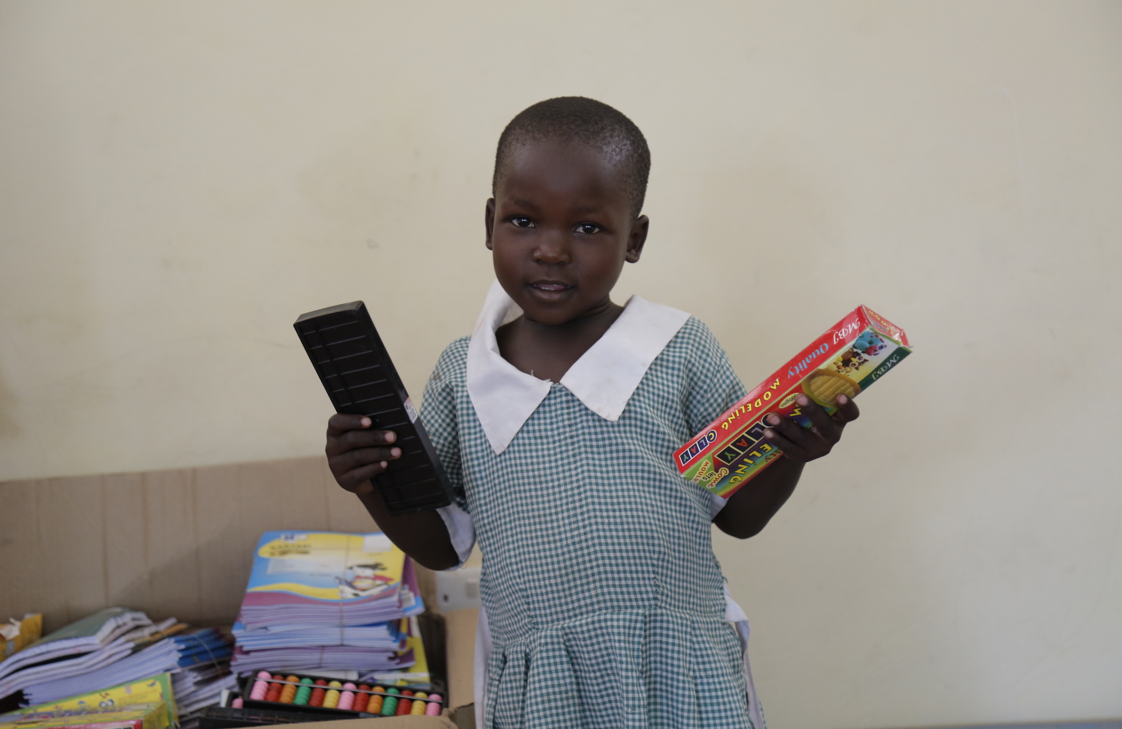 The crayons and modelling clay that come with the School-in-a- Box Kit are favourites for many pupils. © World Vision Photo/Susan Otieno