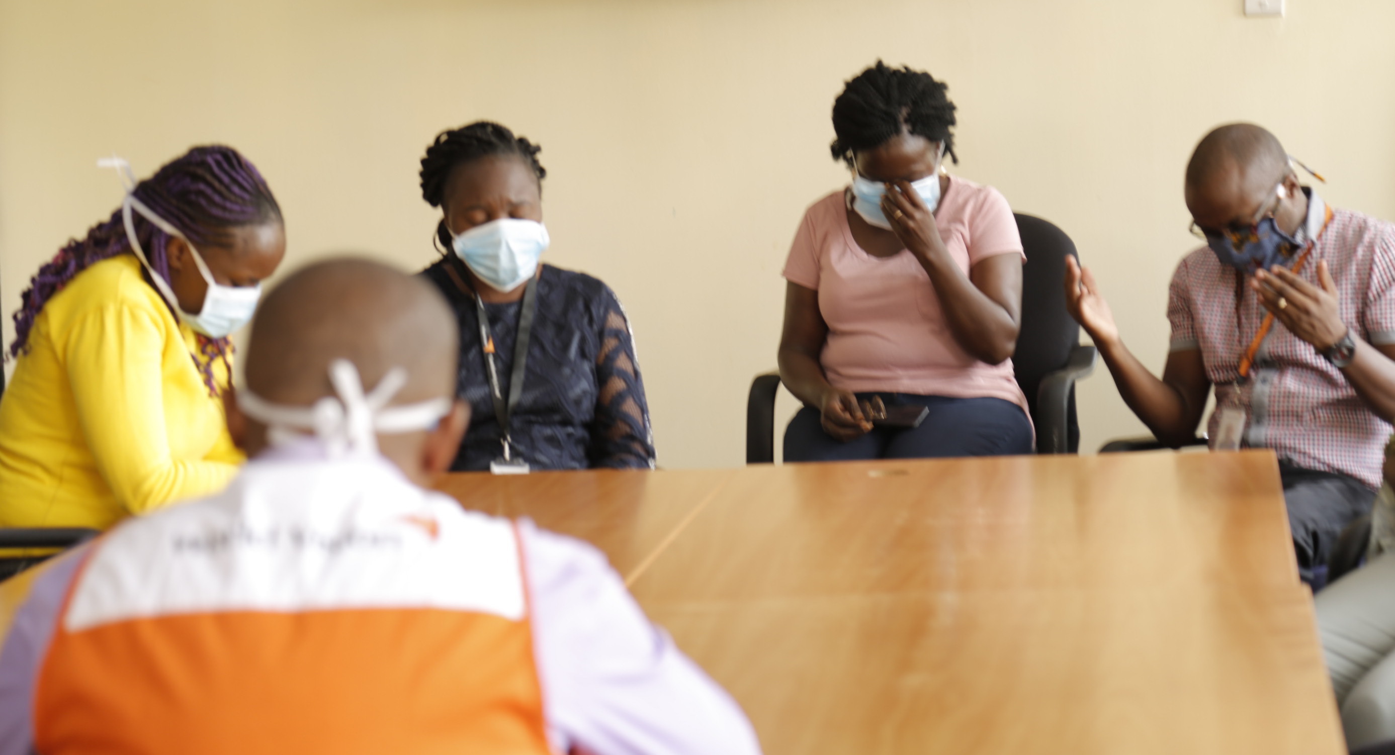 World Vision Staff in Kenya coming together to pray for families affected by COVID-19. ©World Vision Photo/Susan Otieno.