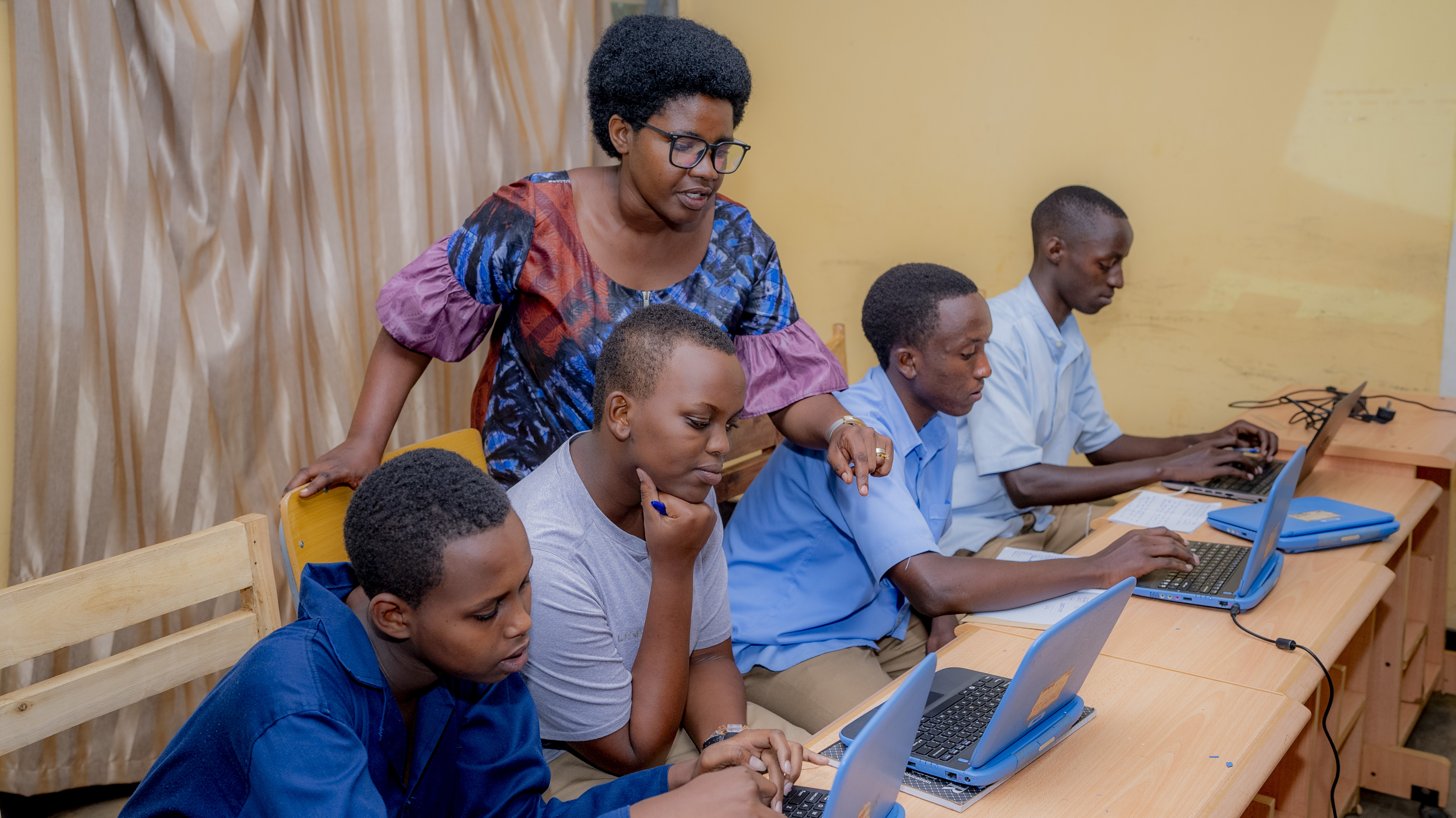 Students at Nyamata Technical Secondary School studying with the use of laptops provided by World Vision
