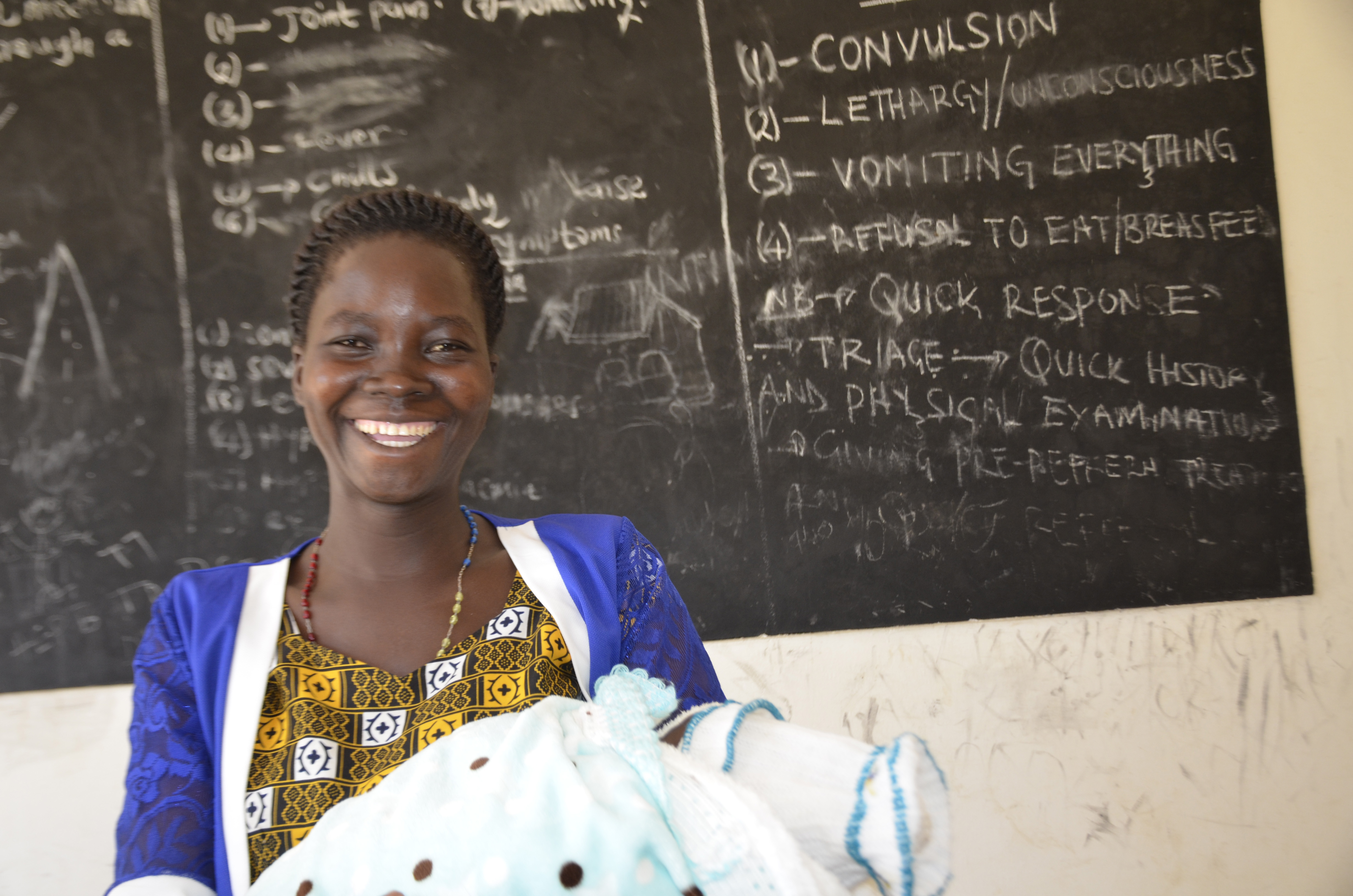 Christine Ayugi (26), a mother of twins in Agago at Pacer Health Centre III for check-up. World Vision reconstructed, equipped and provided latrines and a water system for Pacer Health Center III, Agago, Uganda.