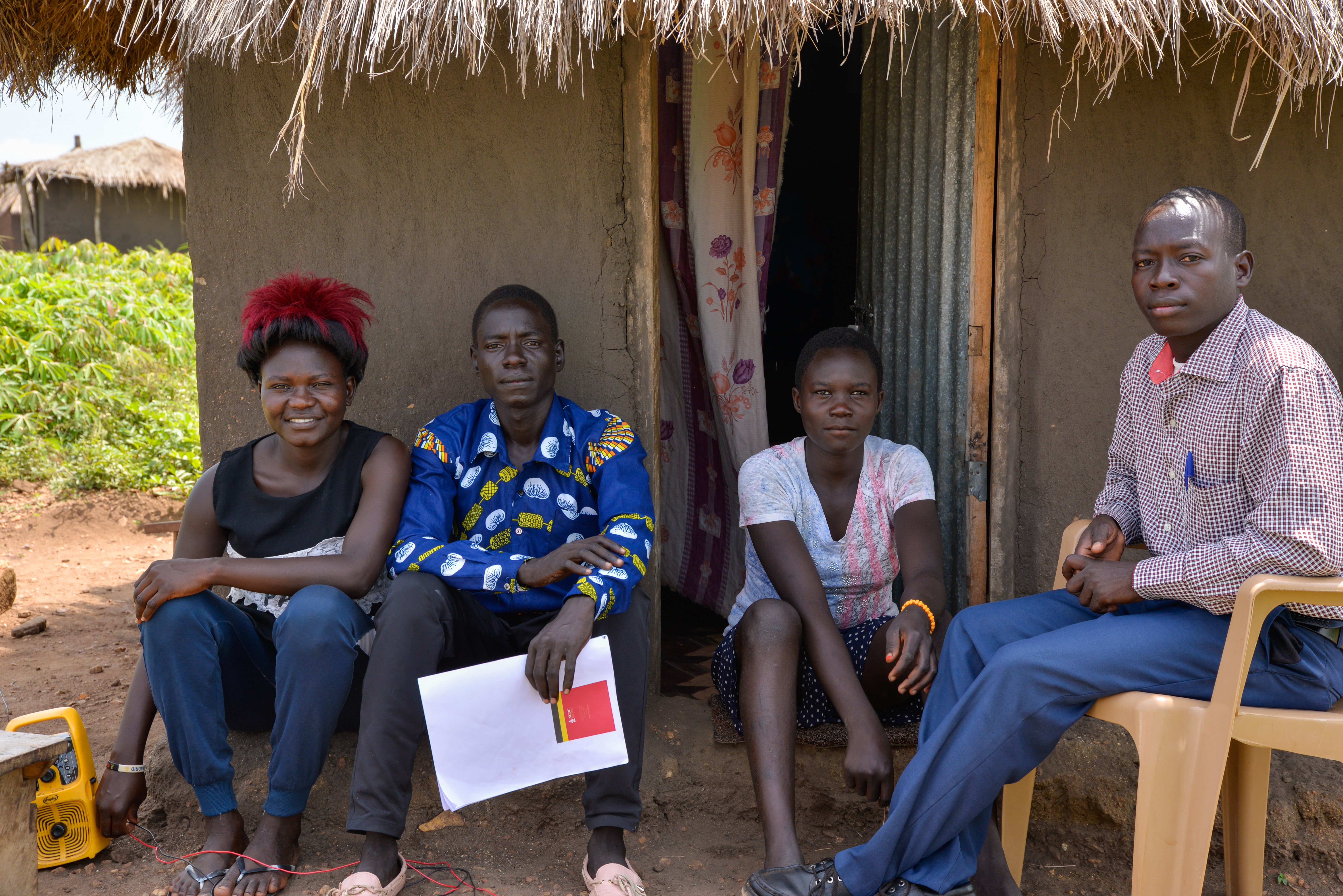 Santos (blue shirt) with his wife, left, his young sister and his elder brother (right)