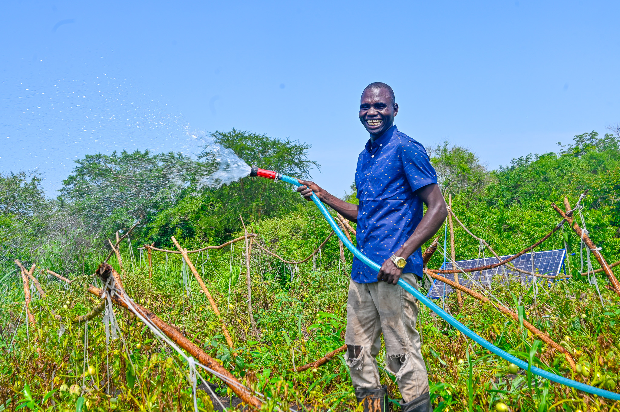Tairi and some members of Kula Tano Farmers Group tending to their vegetable garden. © World Vision Photo/Mungu Jakisa Brian