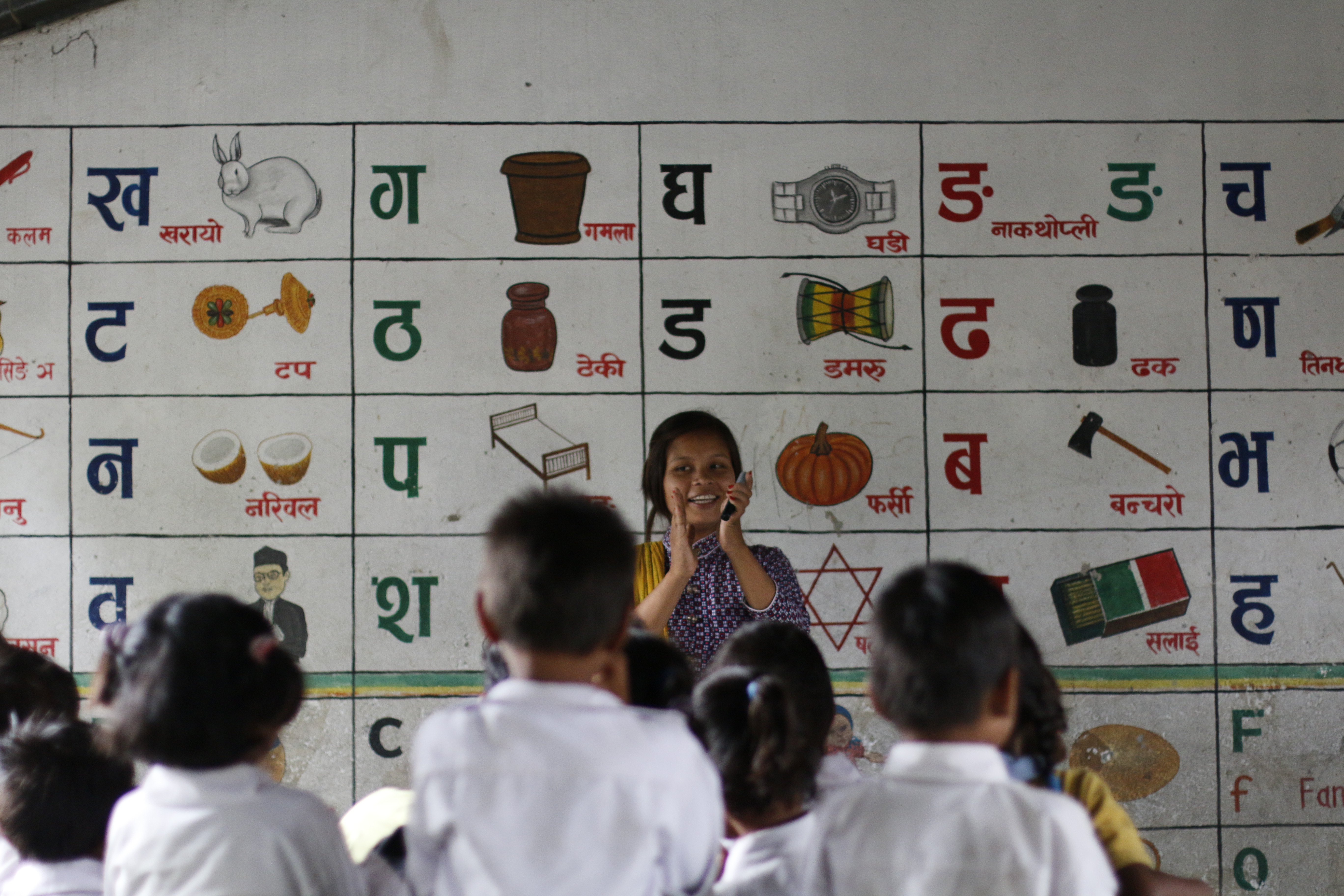 Prabha engages primary level students in a rhymes 