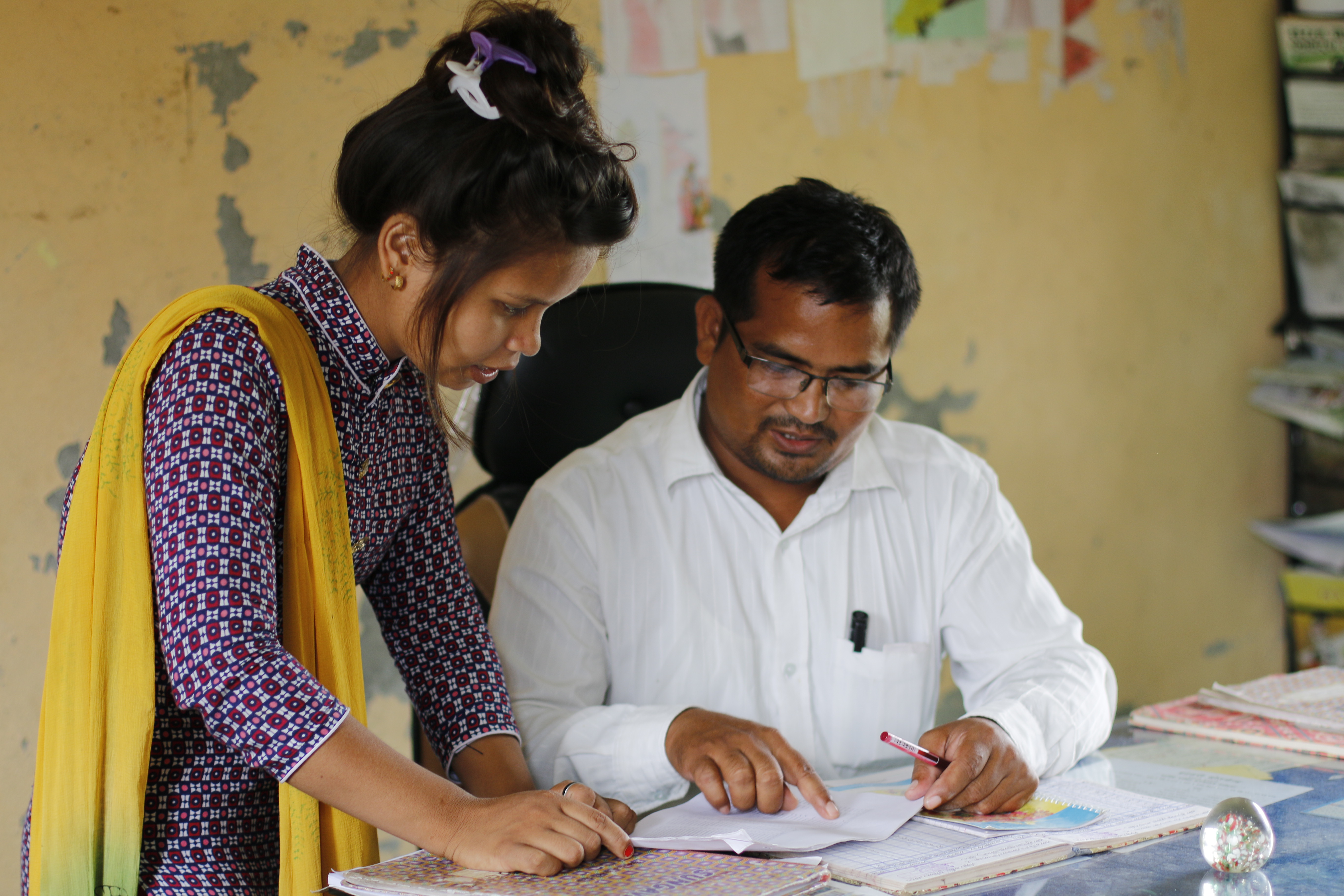 Prabha works along with a teacher of the school 