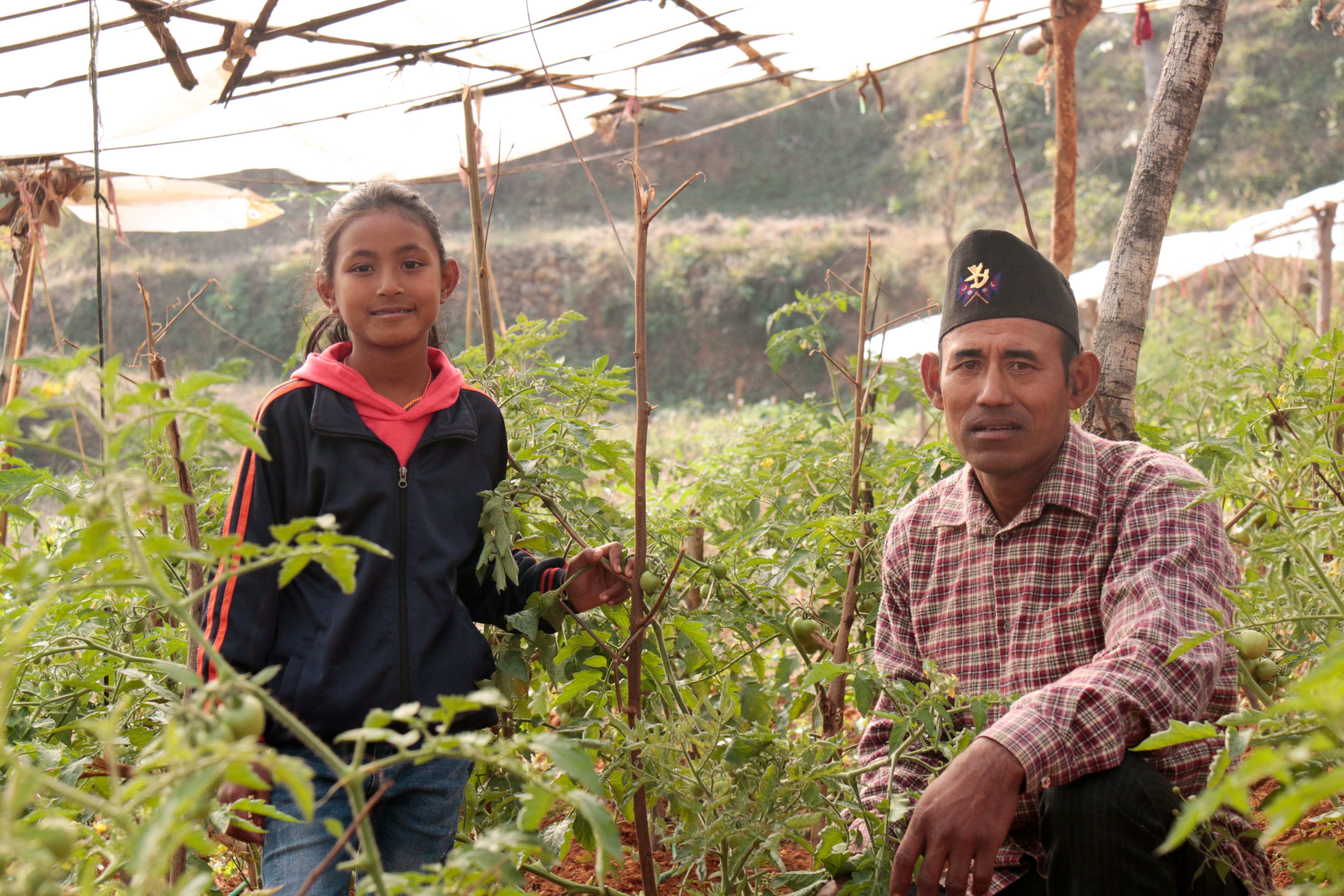Hisila and her father in their farm