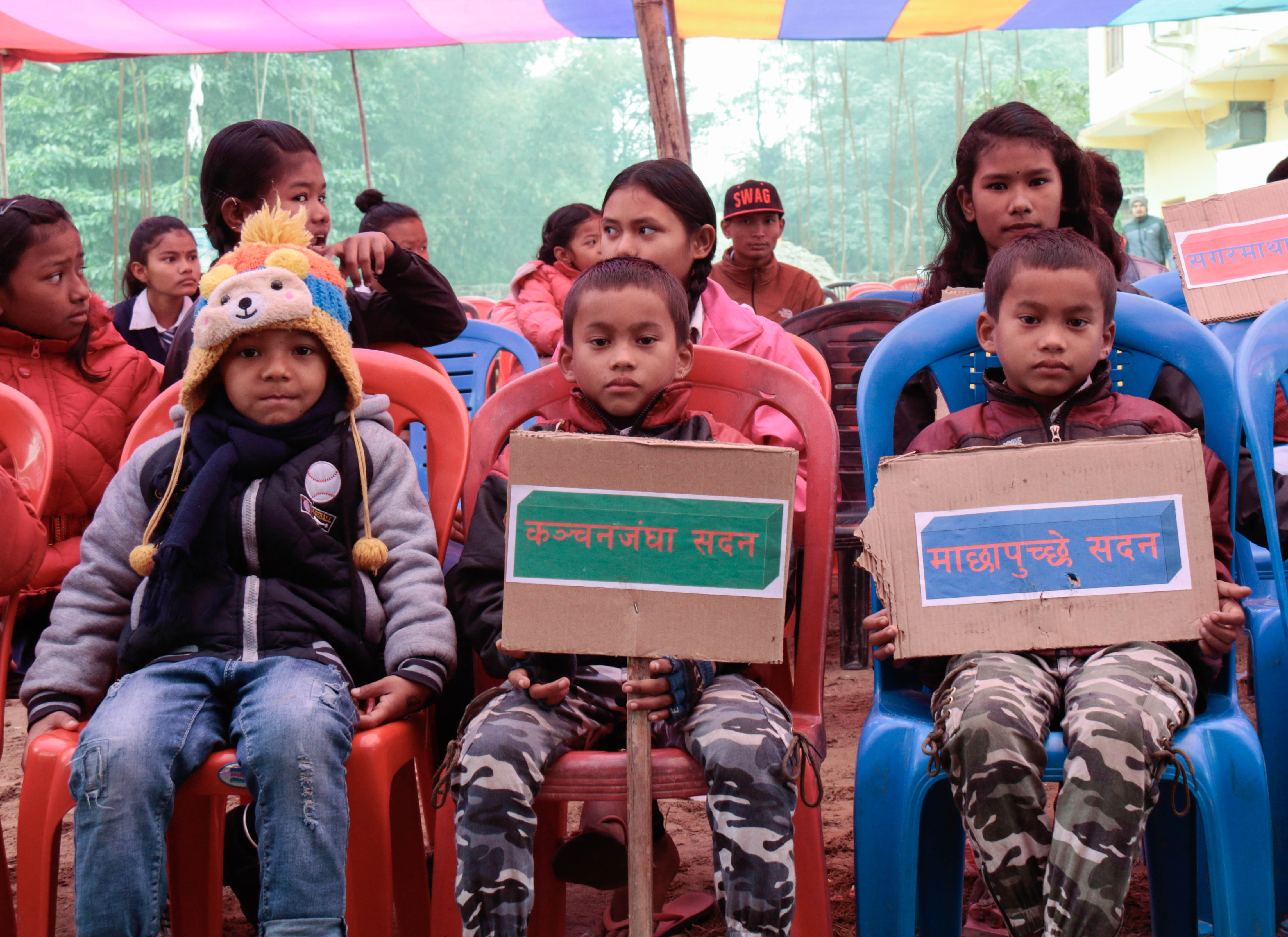 Children display placards at the event