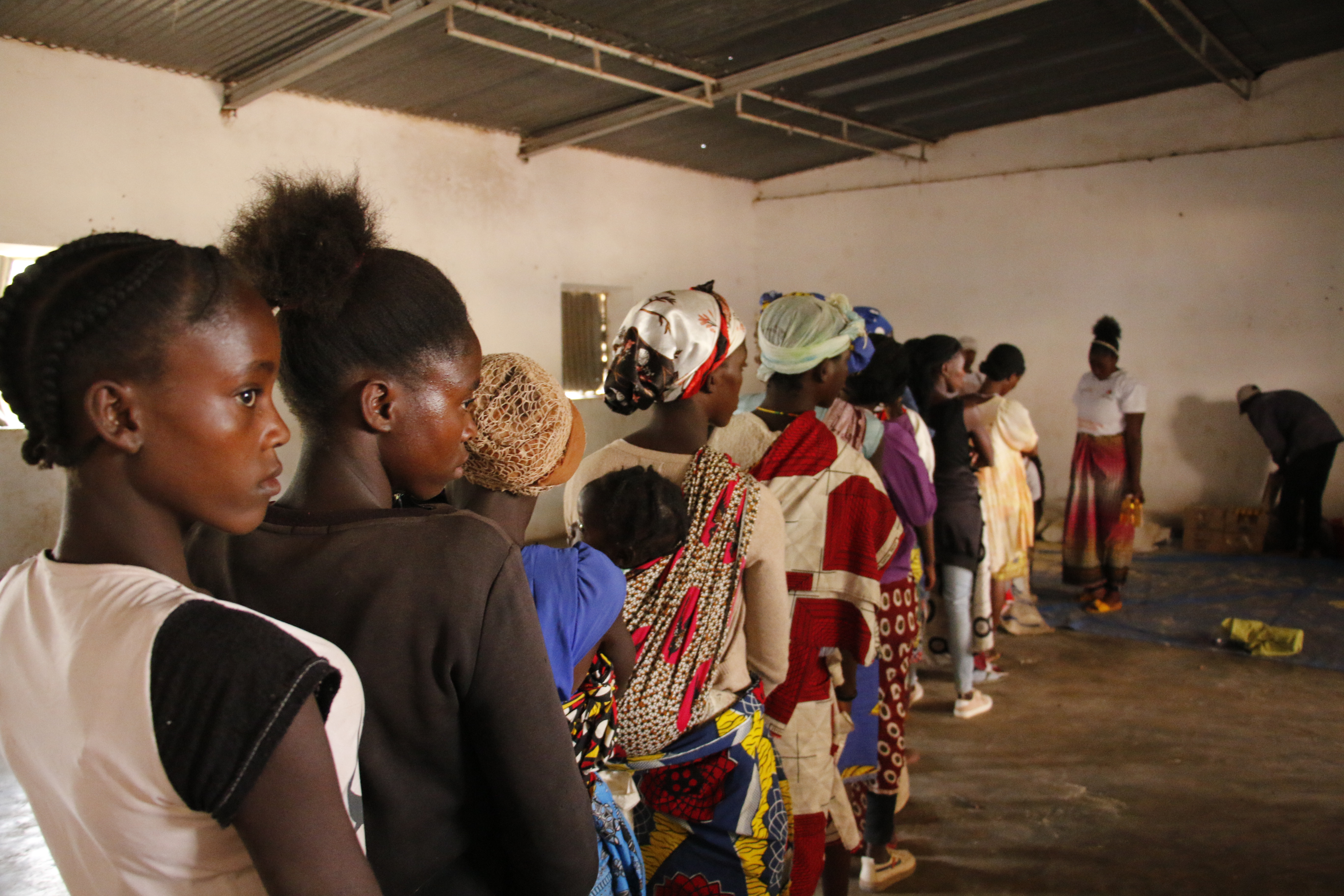 Mothers waiting on the line to receive premix flour