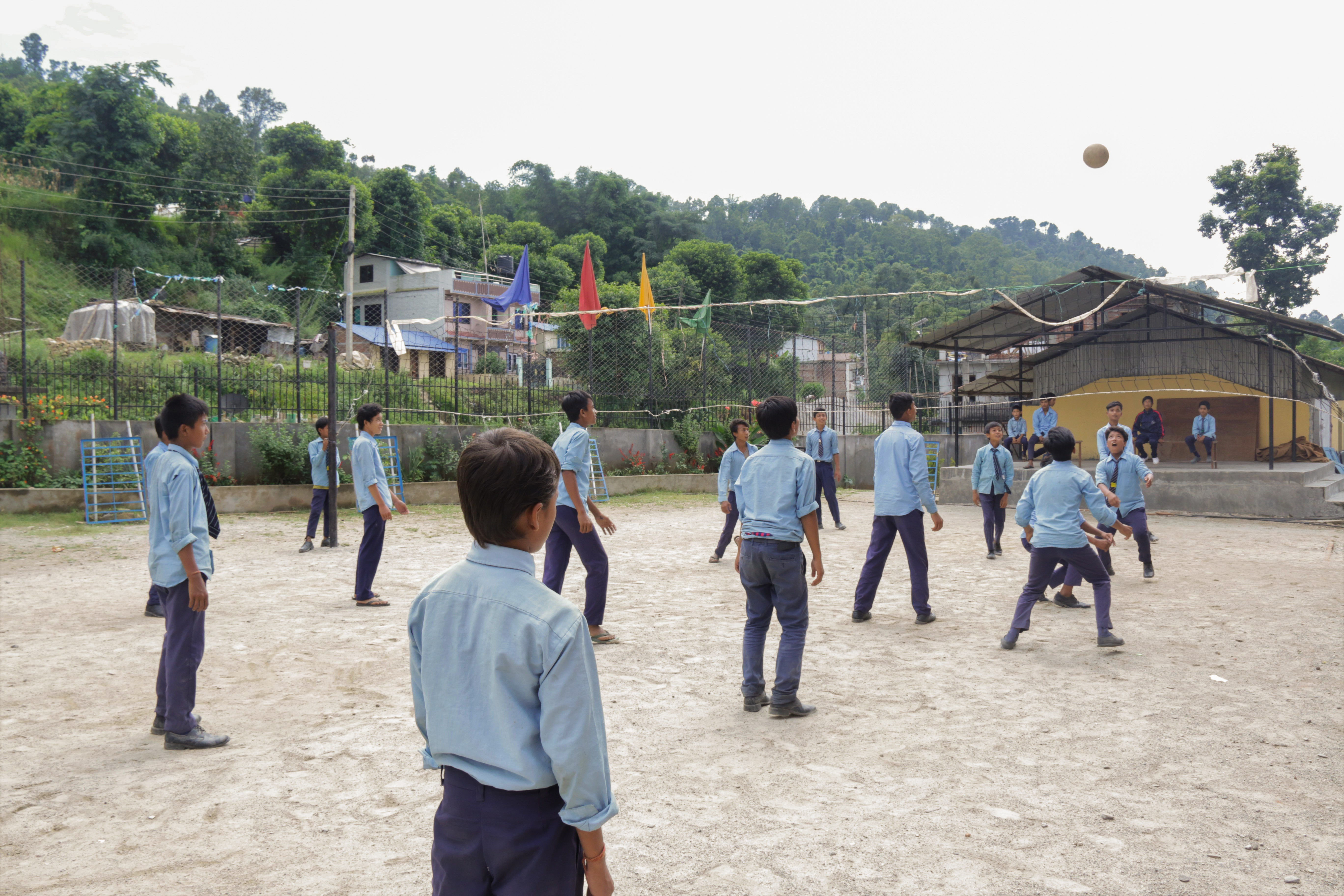 Students play volleyball in the school