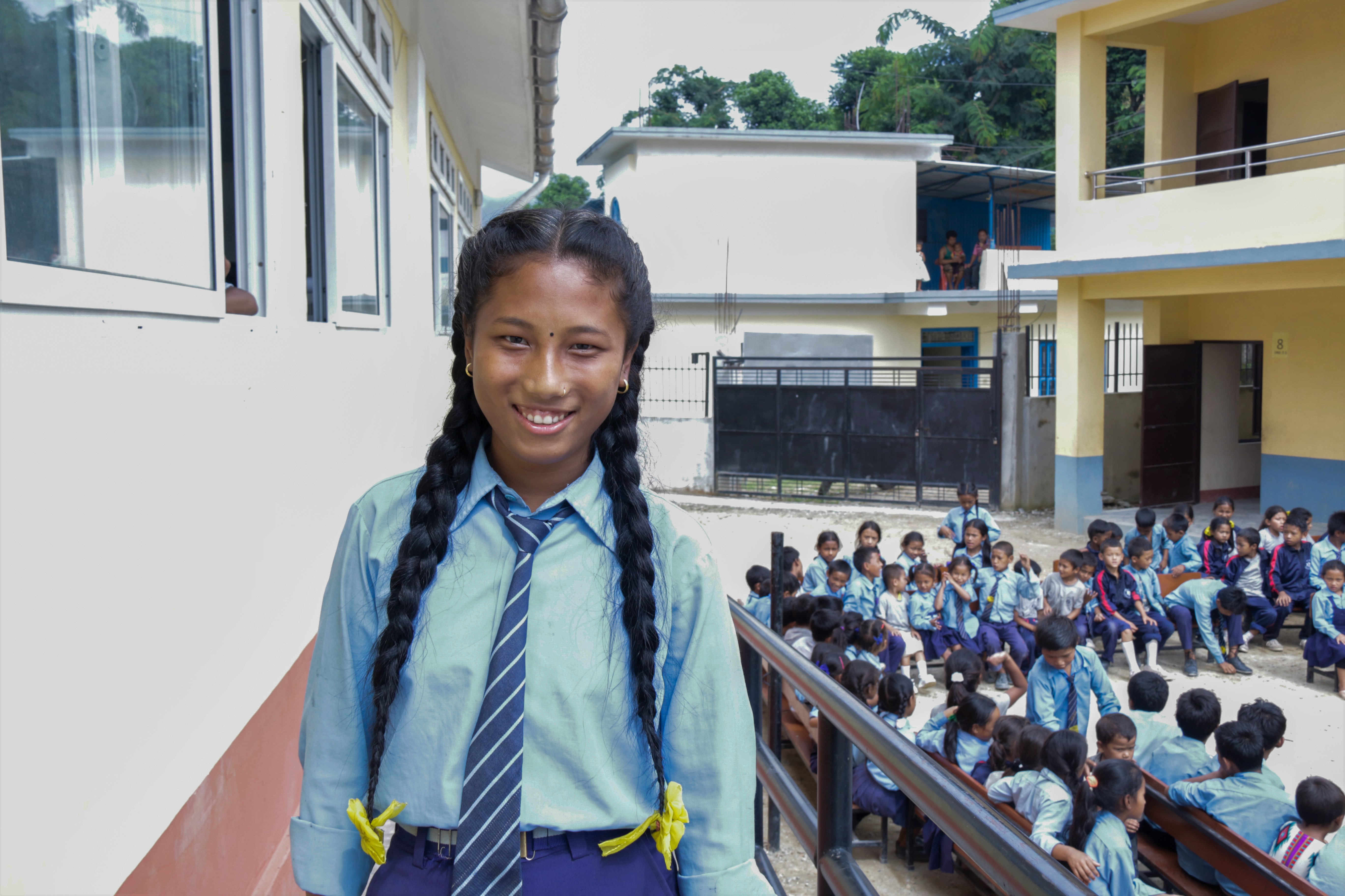A girl student in her school